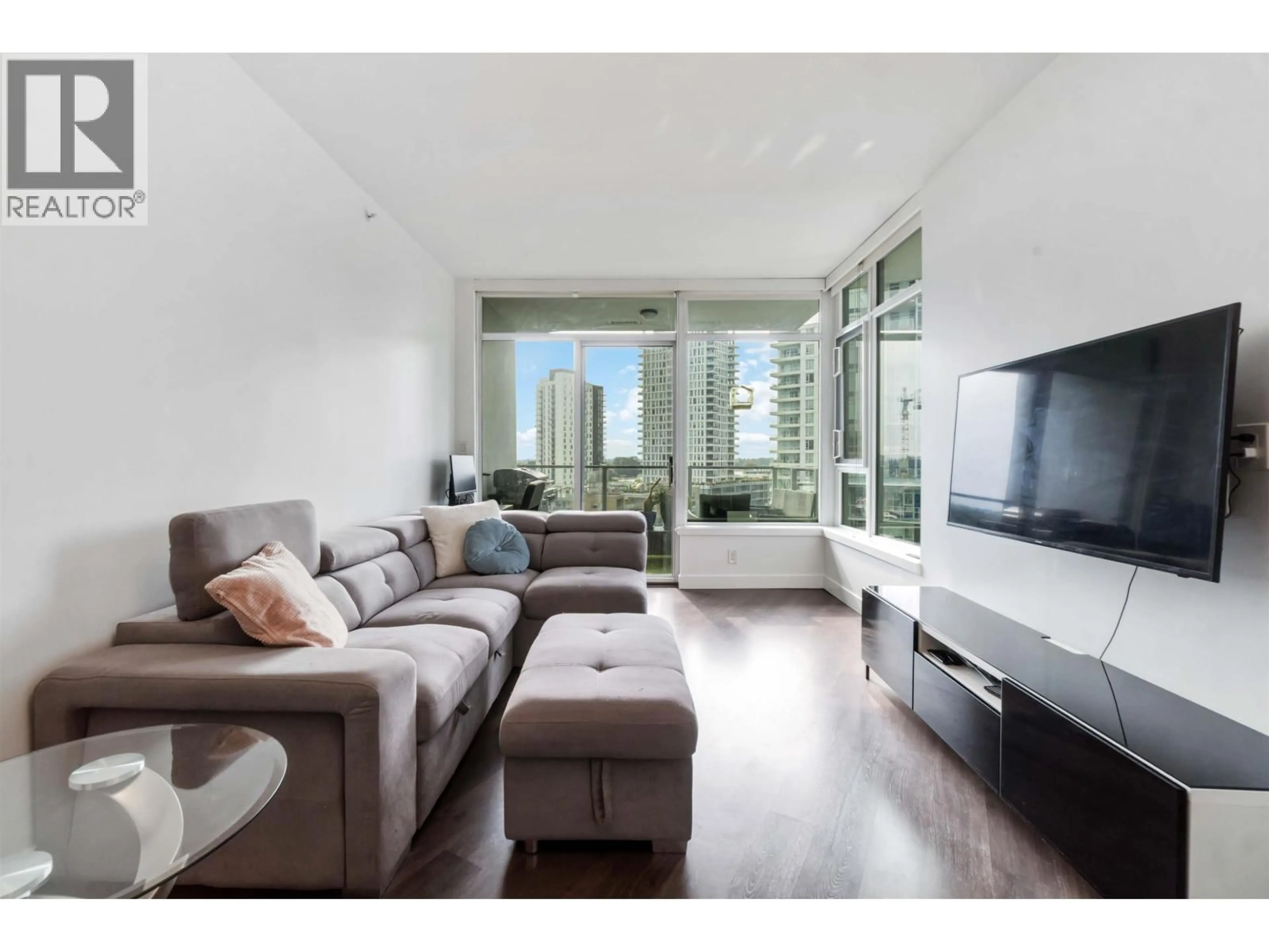 Living room with furniture, wood/laminate floor for 1006 - 3557 SAWMILL CRESCENT, Vancouver British Columbia V5S0E2