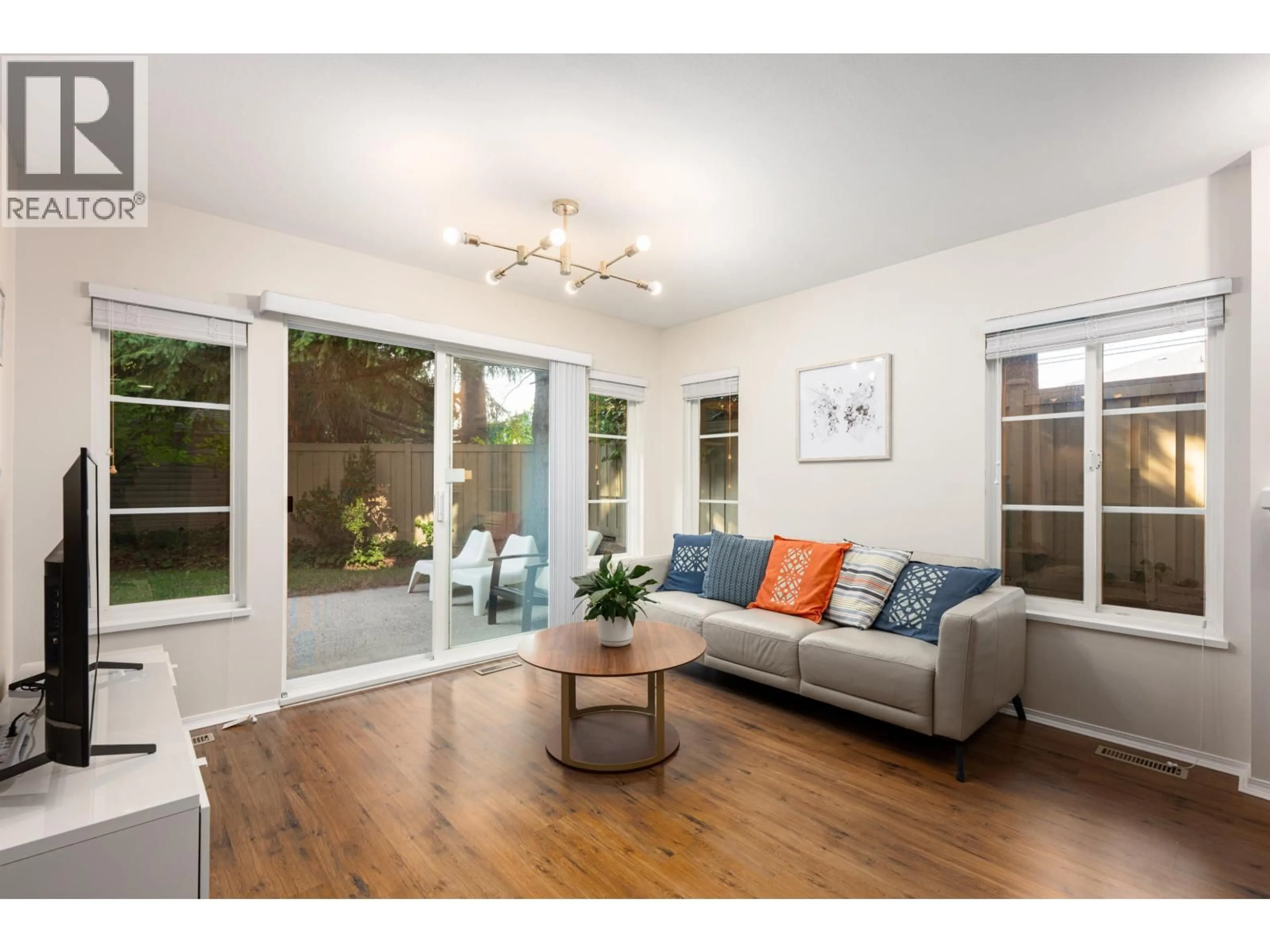 Living room with furniture, wood/laminate floor for 59 - 3088 AIREY DRIVE, Richmond British Columbia V6X4A3