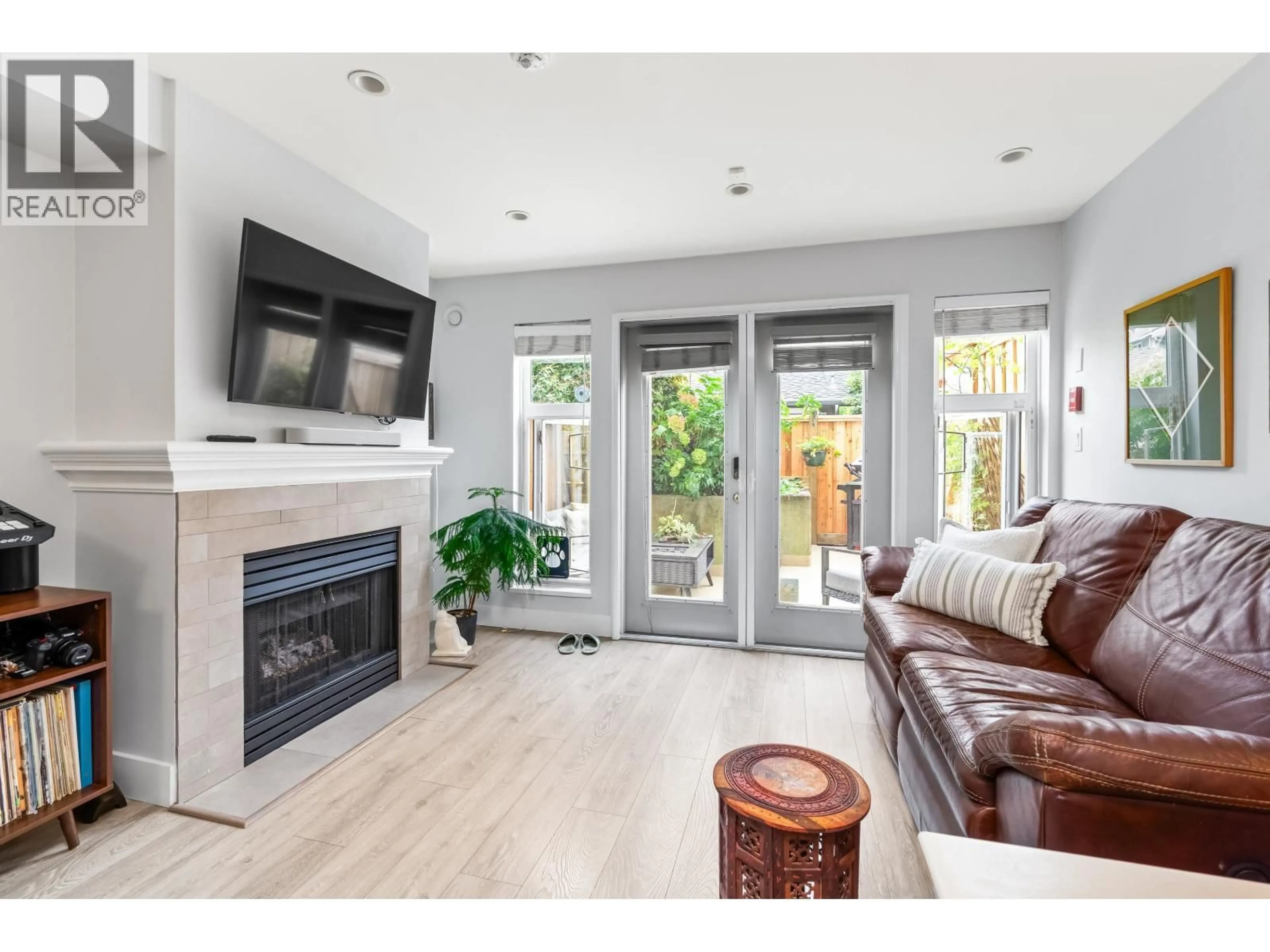 Living room with furniture, wood/laminate floor for 208 - 2545 BROADWAY, Vancouver British Columbia V6K2E9