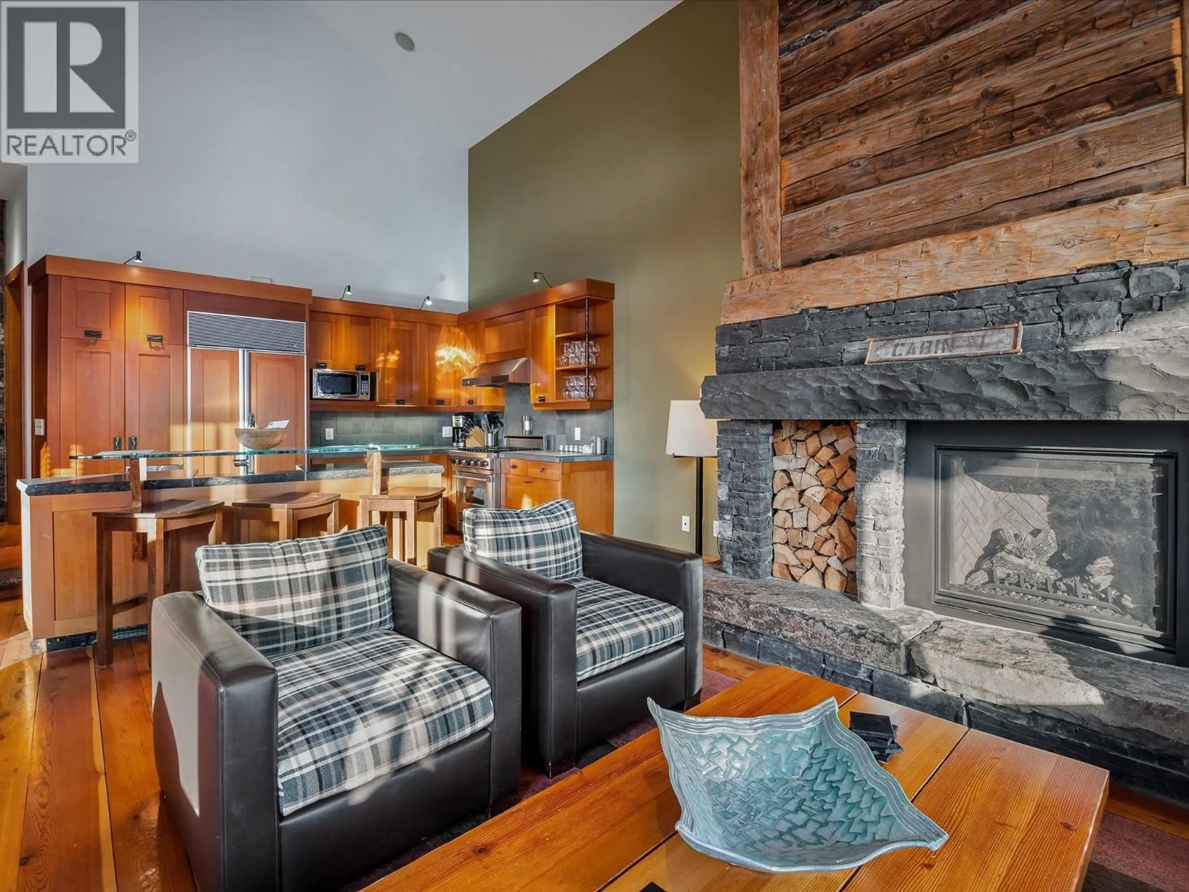 Living room with furniture, wood/laminate floor for 1B - 2300 NORDIC DRIVE, Whistler British Columbia V8E0A6