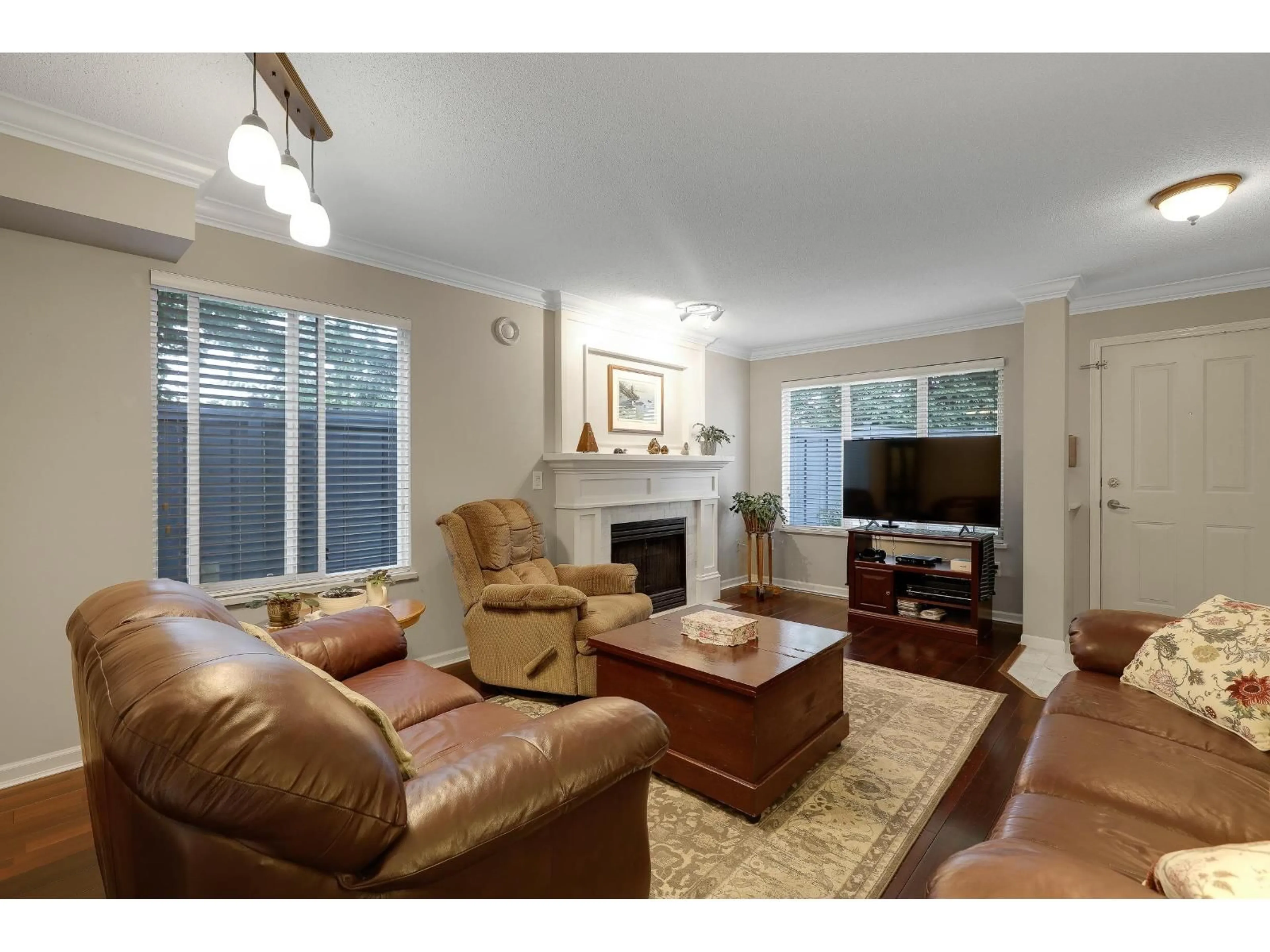 Living room with furniture, wood/laminate floor for 40 - 18883 65, Surrey British Columbia V3S8Y2
