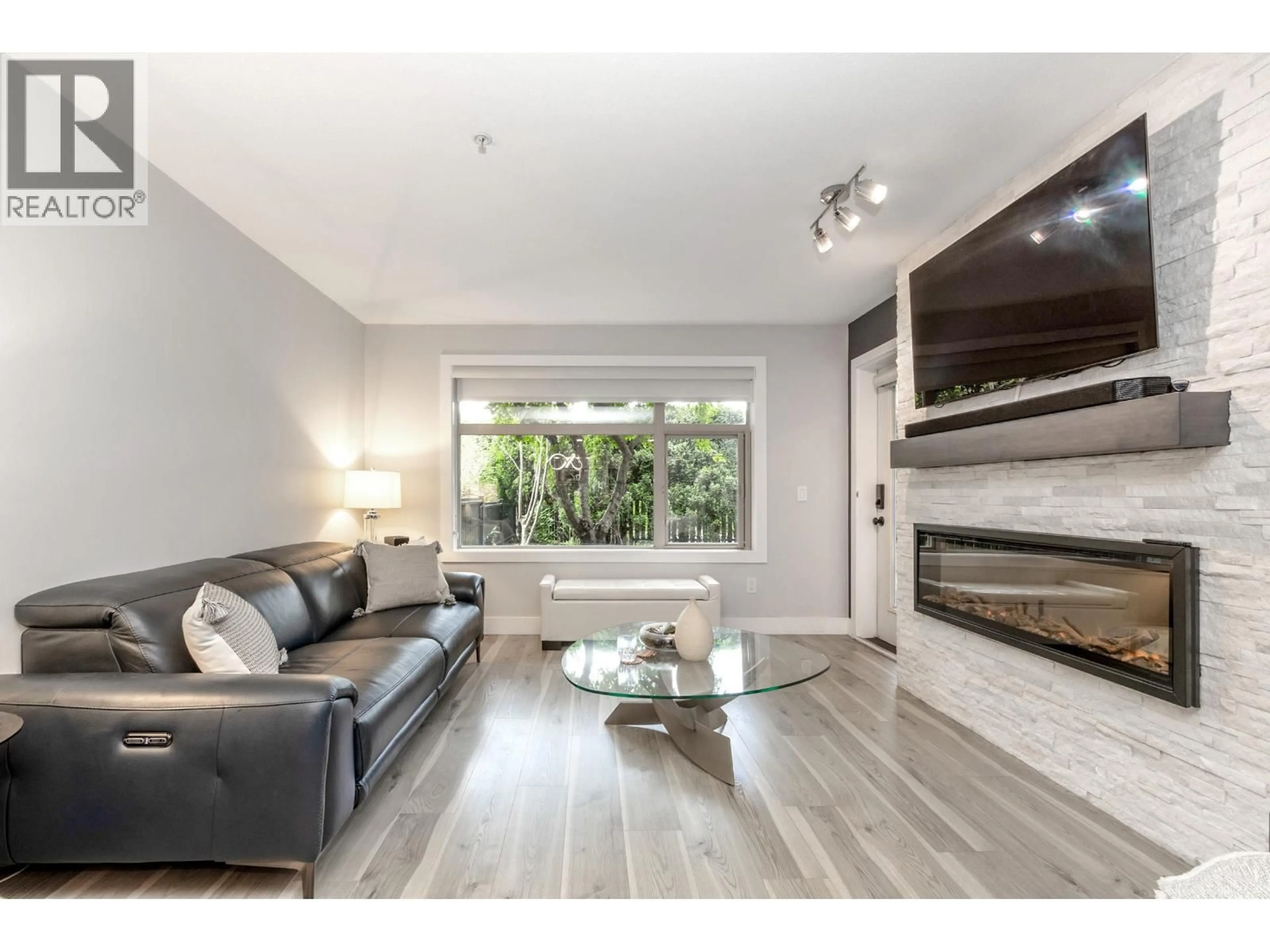 Living room with furniture, wood/laminate floor for 109 - 400 KLAHANIE DRIVE, Port Moody British Columbia V3H5K9