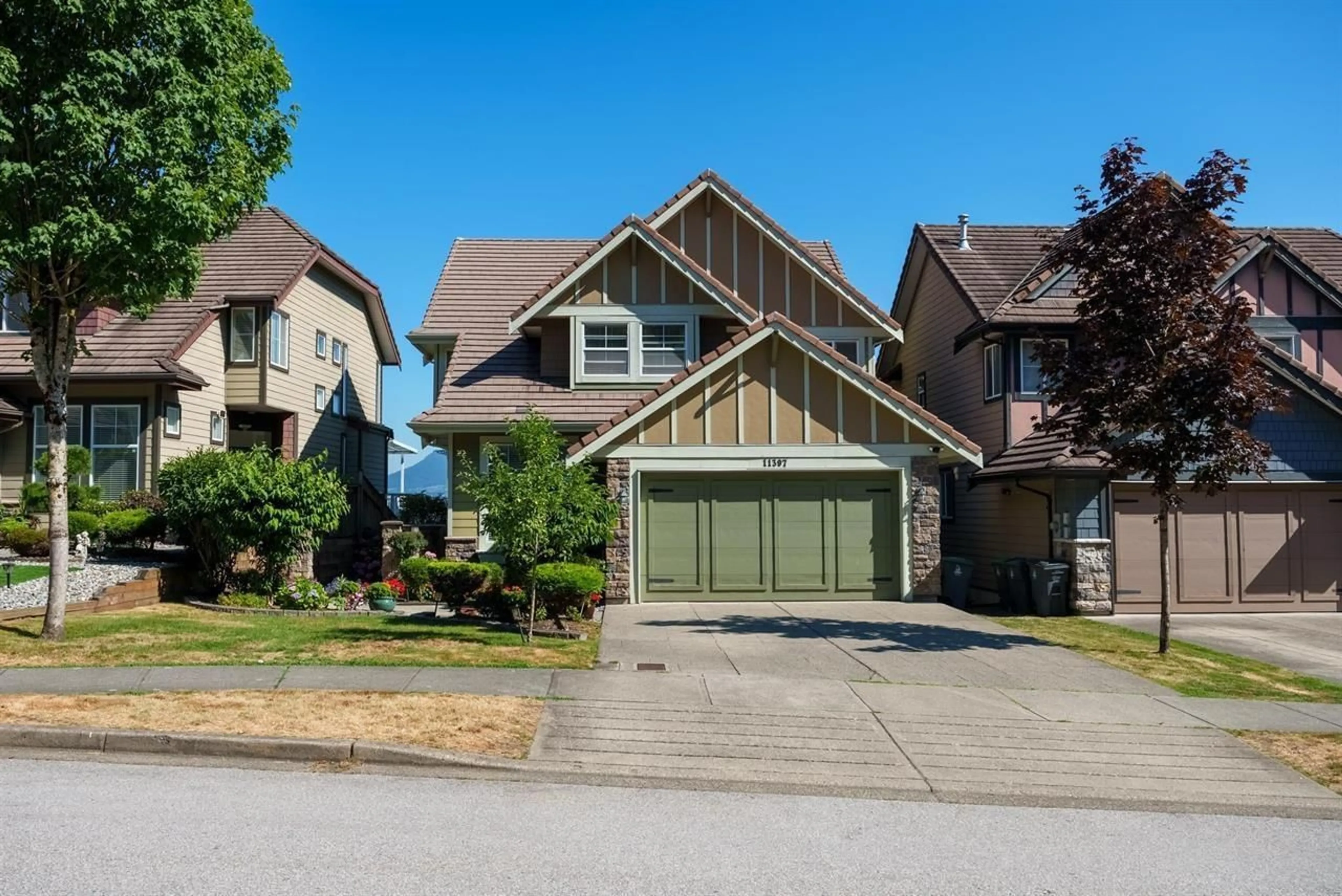 Home with vinyl exterior material, street for 11397 154A, Surrey British Columbia V3R2V7