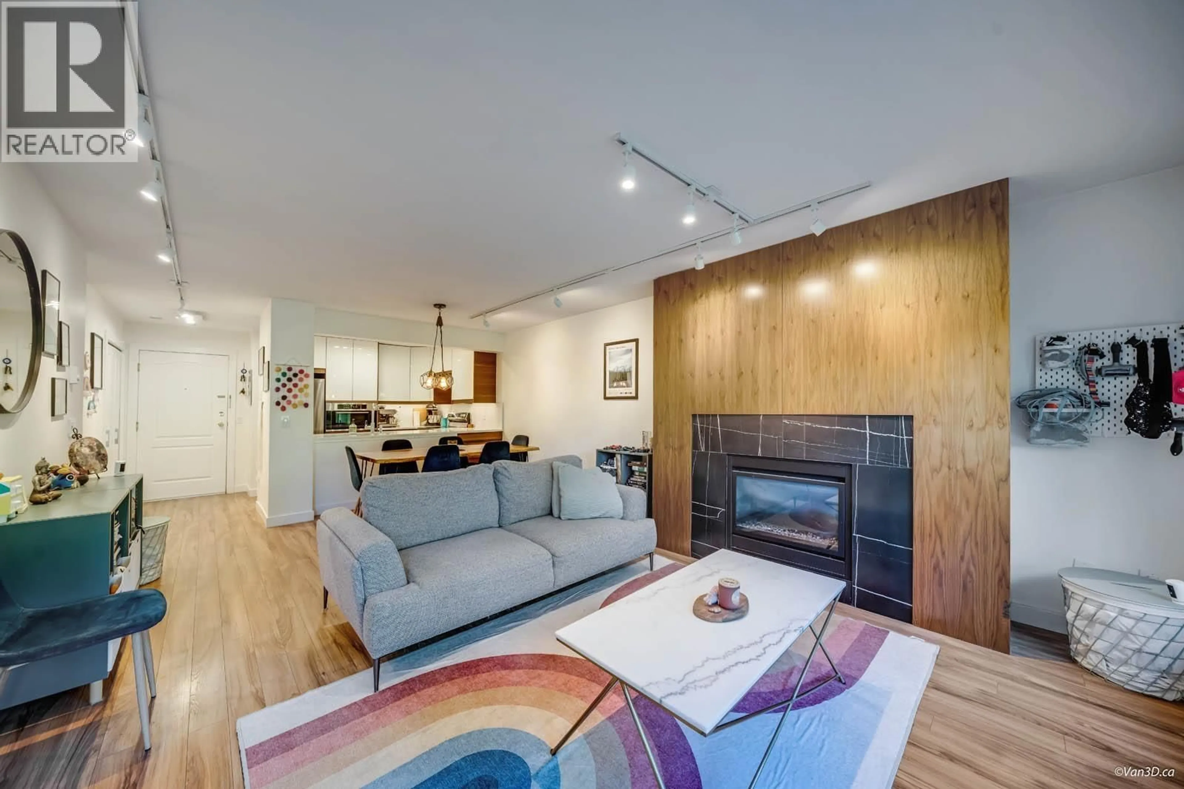 Living room with furniture, wood/laminate floor for 116 - 3770 MANOR STREET, Burnaby British Columbia V5G4T5