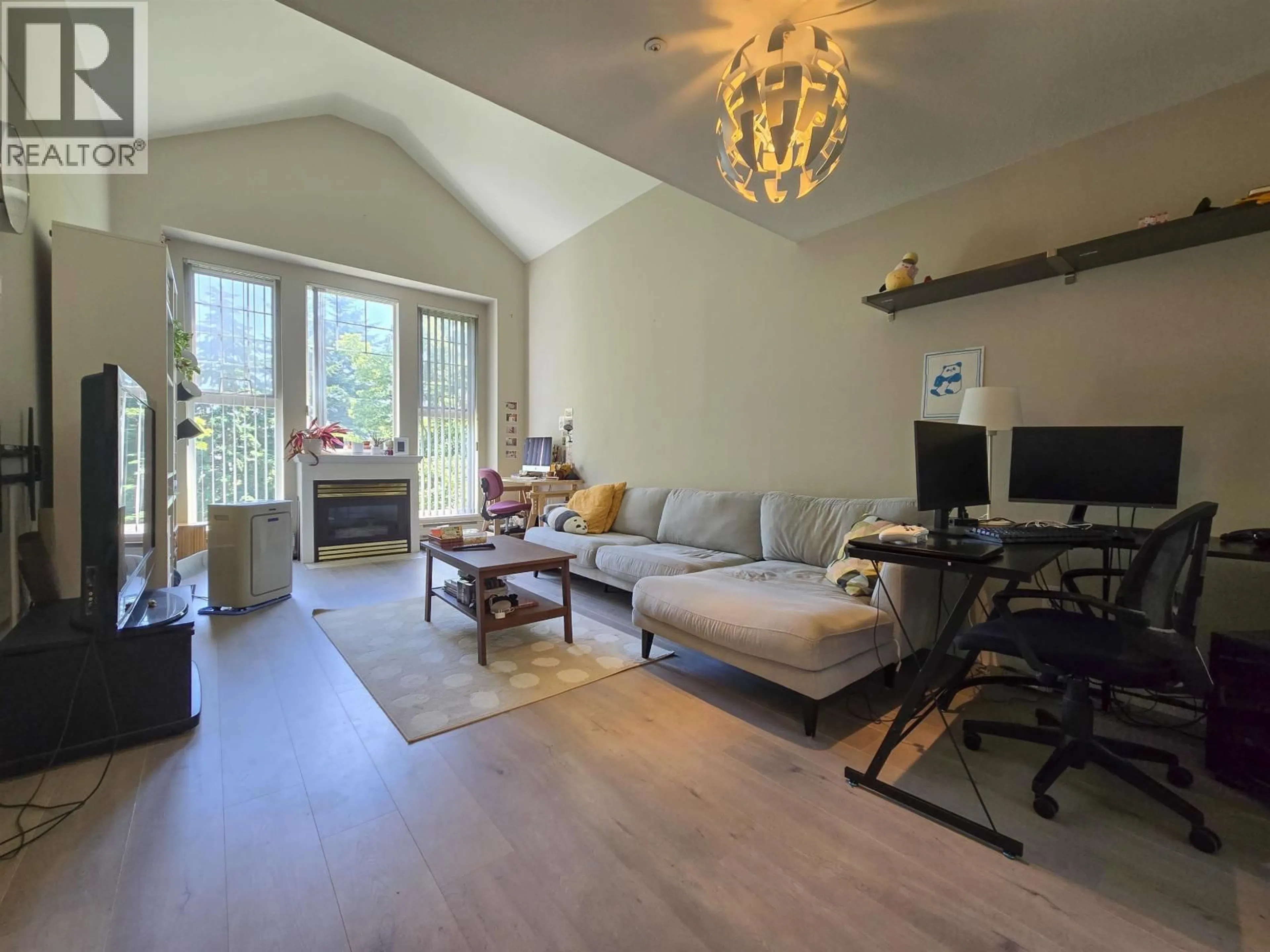 Living room with furniture, wood/laminate floor for 406 - 1190 EASTWOOD STREET, Coquitlam British Columbia V3B7S1