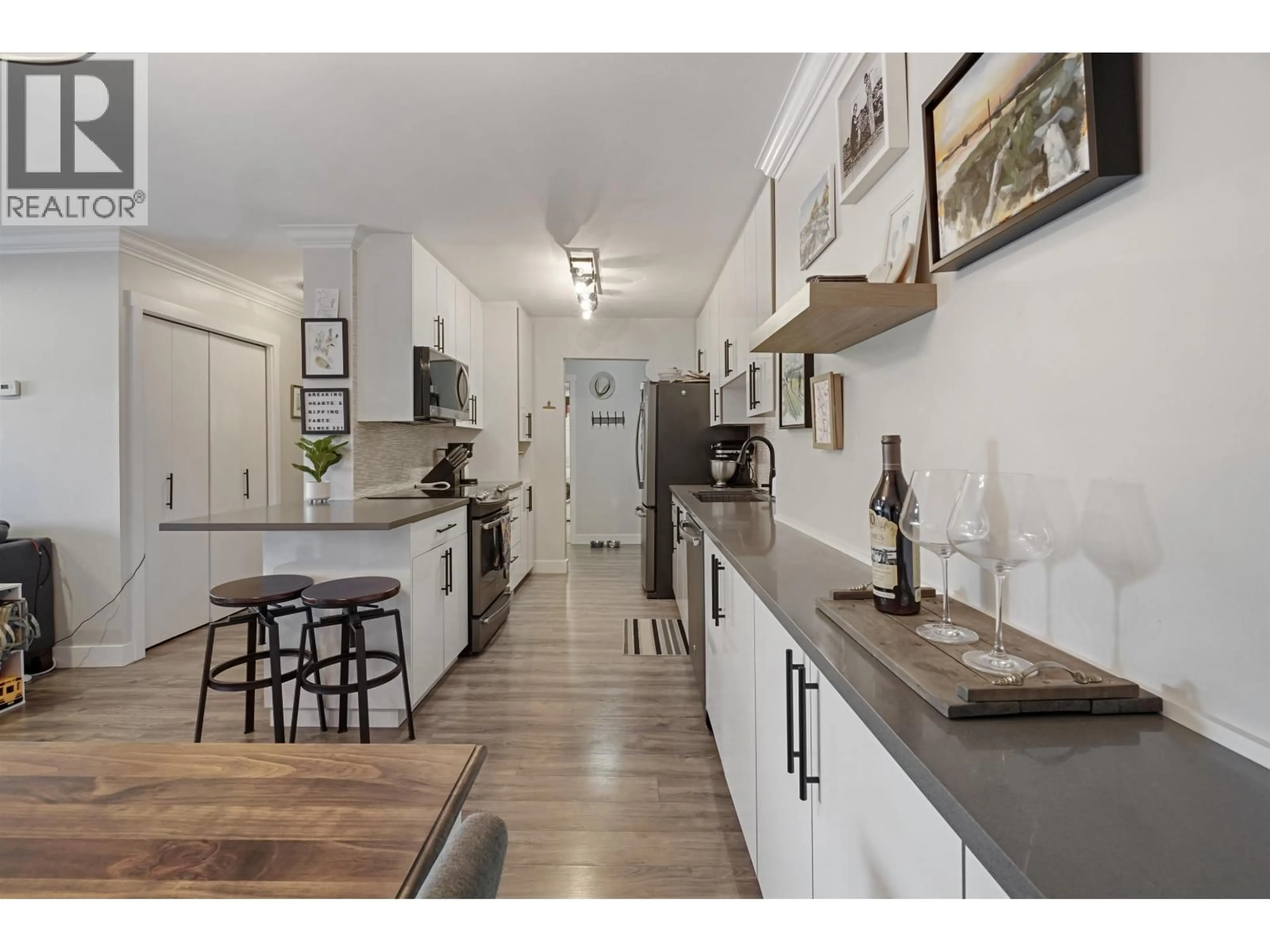 Open concept kitchen, unknown for 103 - 8740 NO. 1 ROAD, Richmond British Columbia V7C4L5