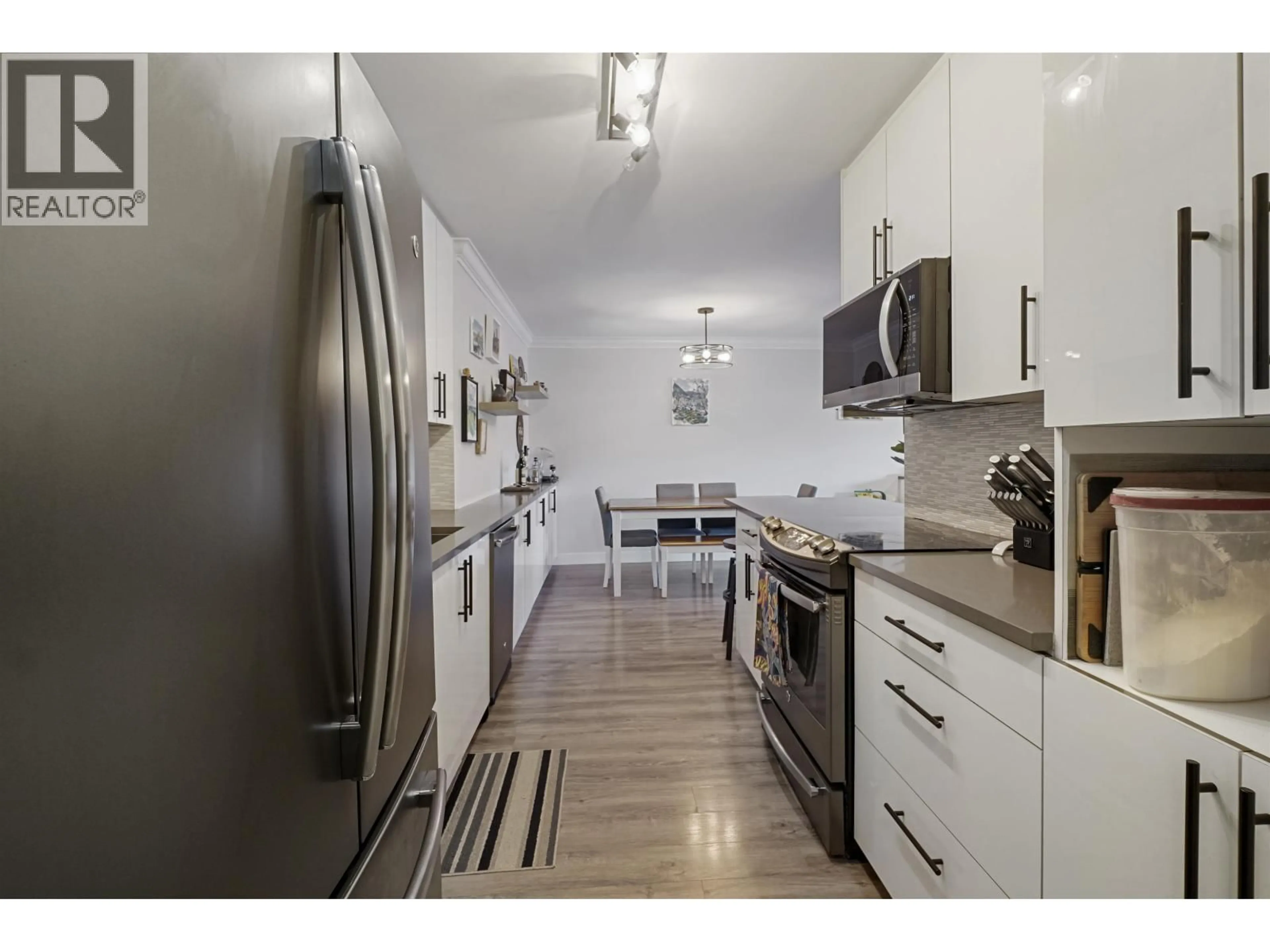 Open concept kitchen, unknown for 103 - 8740 NO. 1 ROAD, Richmond British Columbia V7C4L5