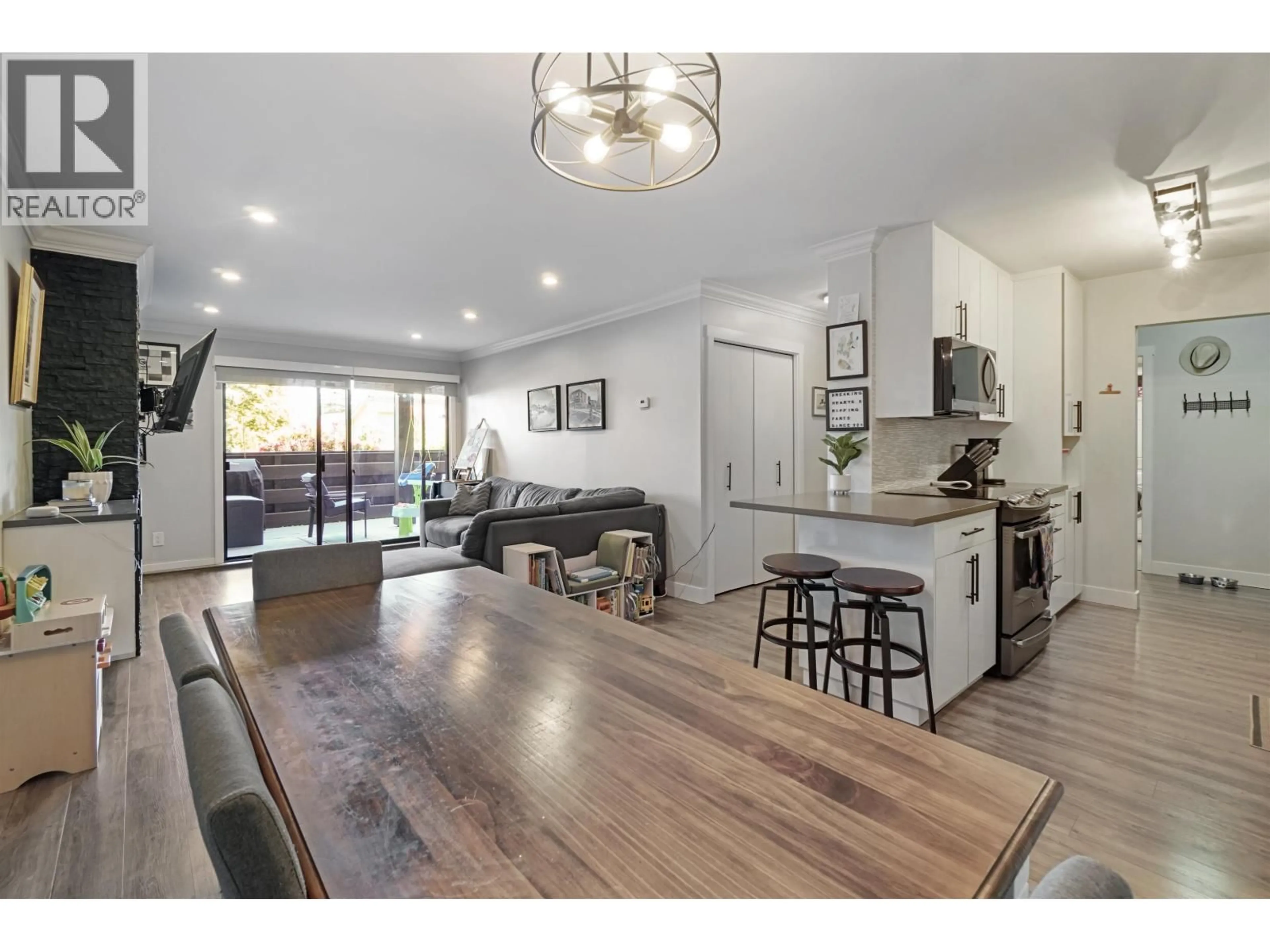 Open concept kitchen, wood/laminate floor for 103 - 8740 NO. 1 ROAD, Richmond British Columbia V7C4L5