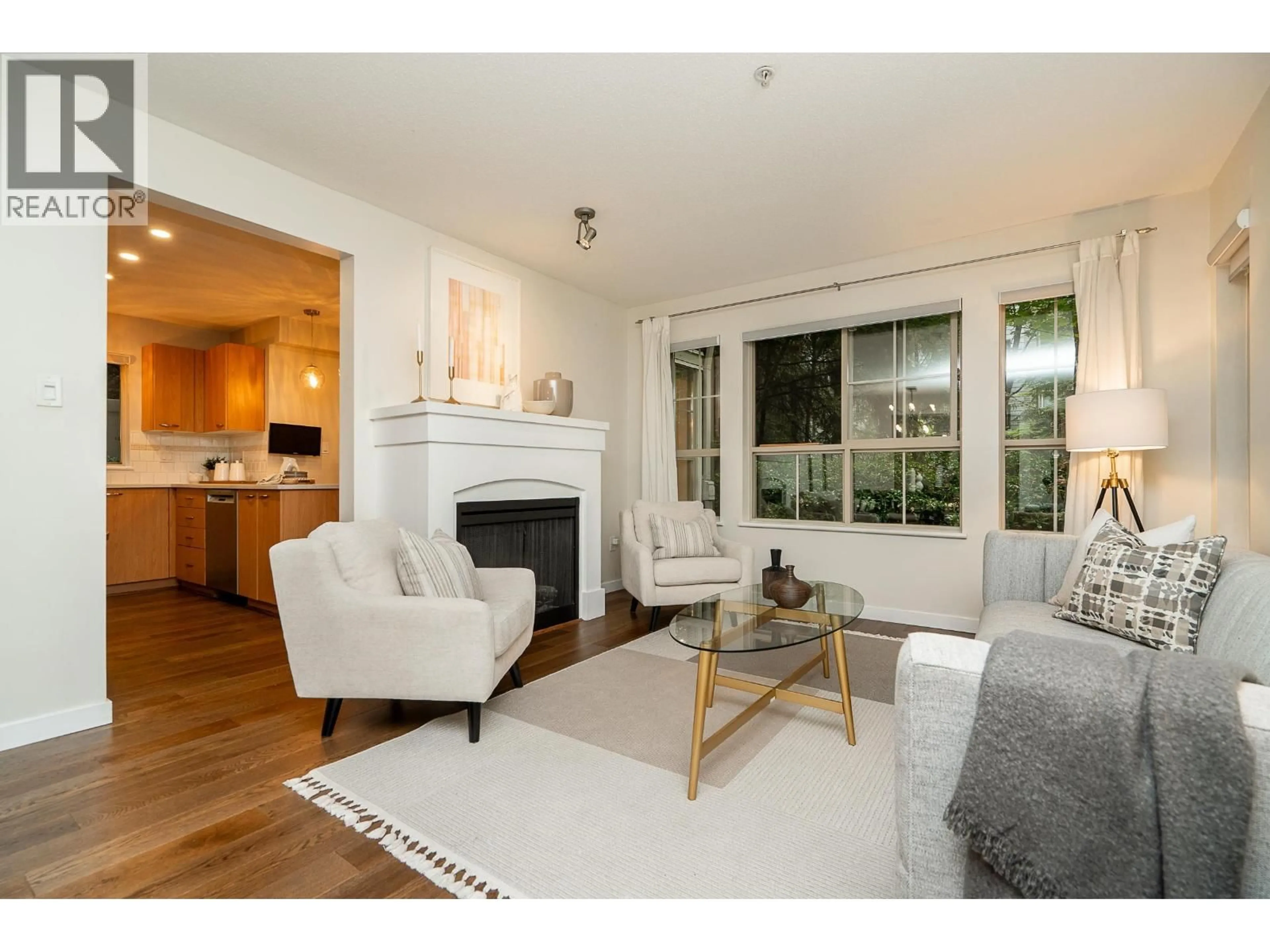 Living room with furniture, wood/laminate floor for 202 - 2966 SILVER SPRINGS BOULEVARD, Coquitlam British Columbia V3E3S1