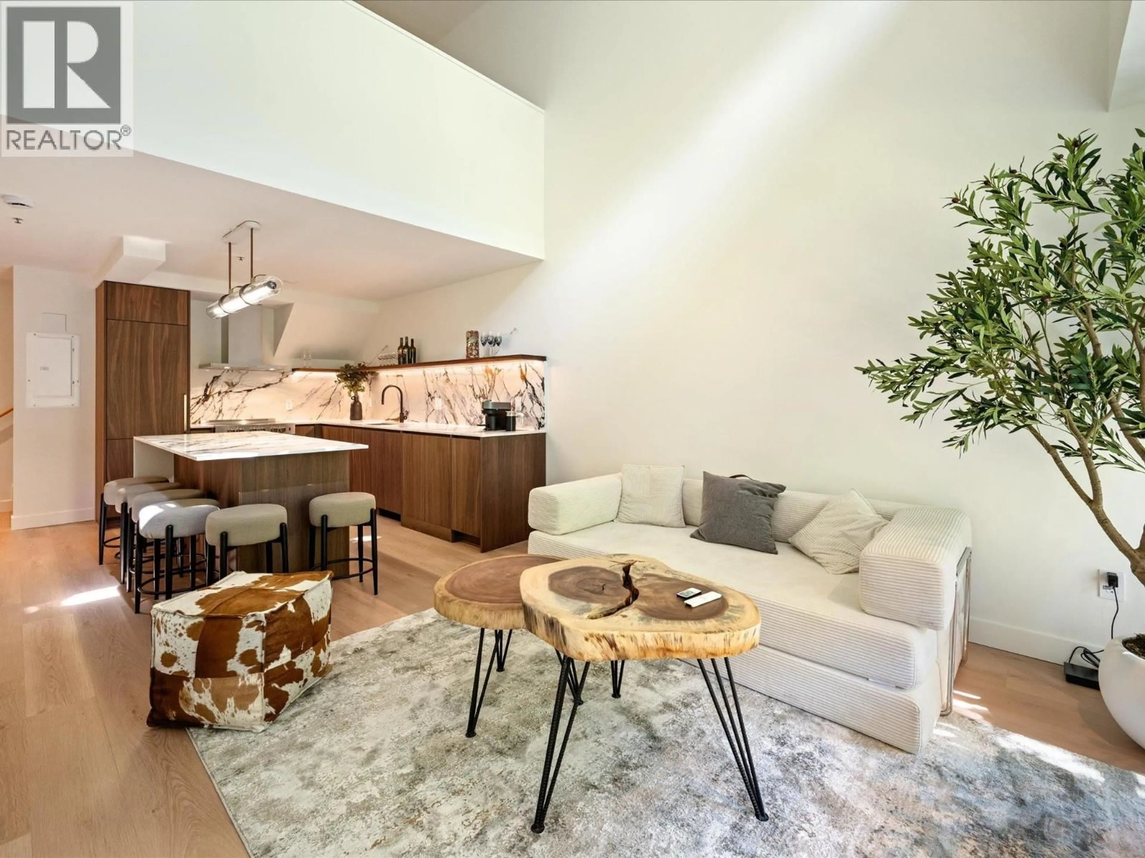 Living room with furniture, wood/laminate floor for 310 - 4573 CHATEAU BOULEVARD, Whistler British Columbia V0N1B4