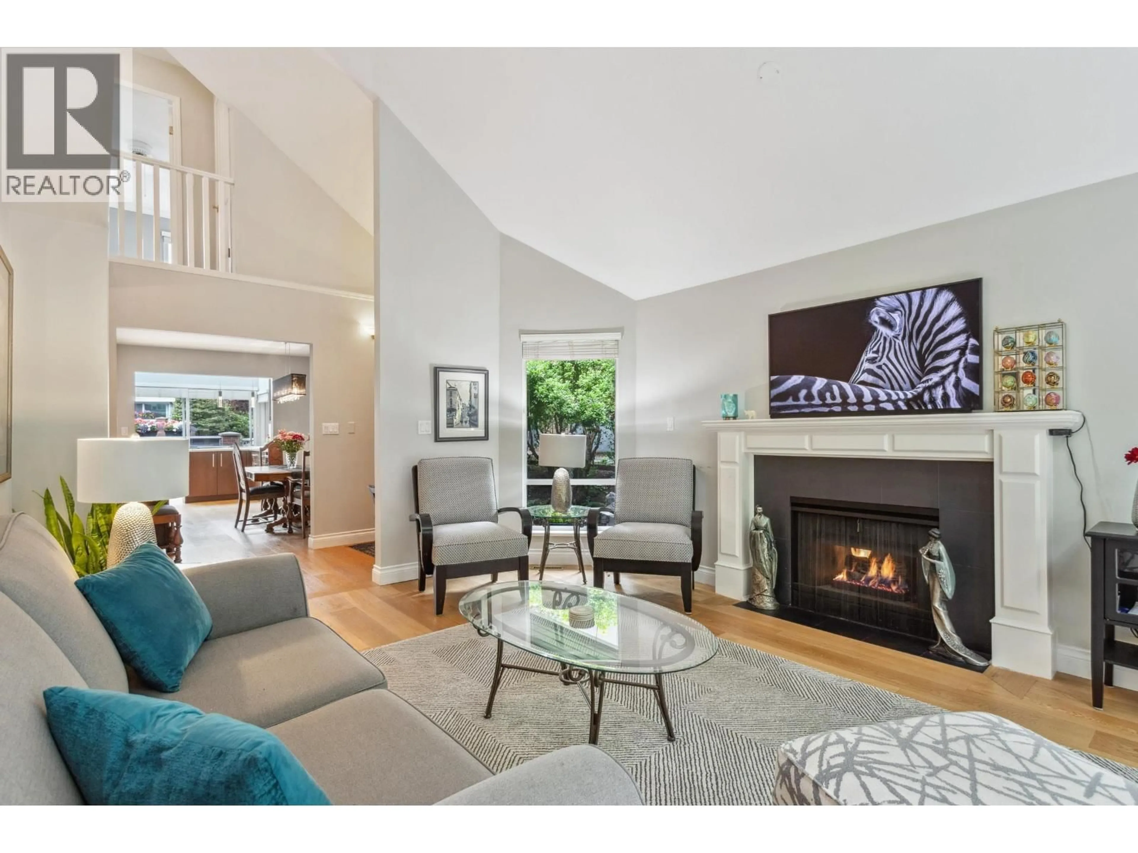 Living room with furniture, wood/laminate floor for 36 - 1925 INDIAN RIVER CRESCENT, North Vancouver British Columbia V7G2P8