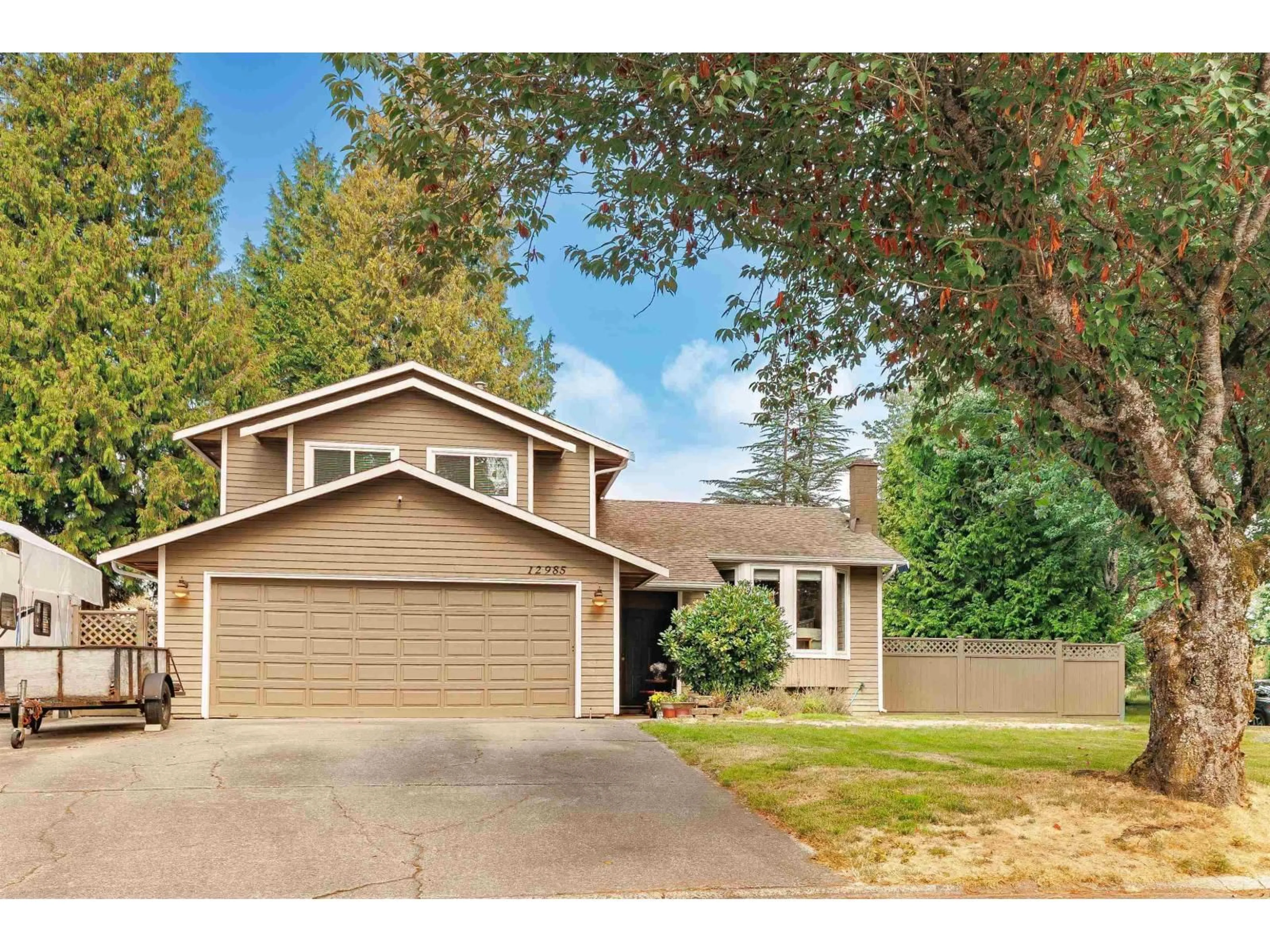 Home with vinyl exterior material, street for 12985 61B, Surrey British Columbia V3W8L2