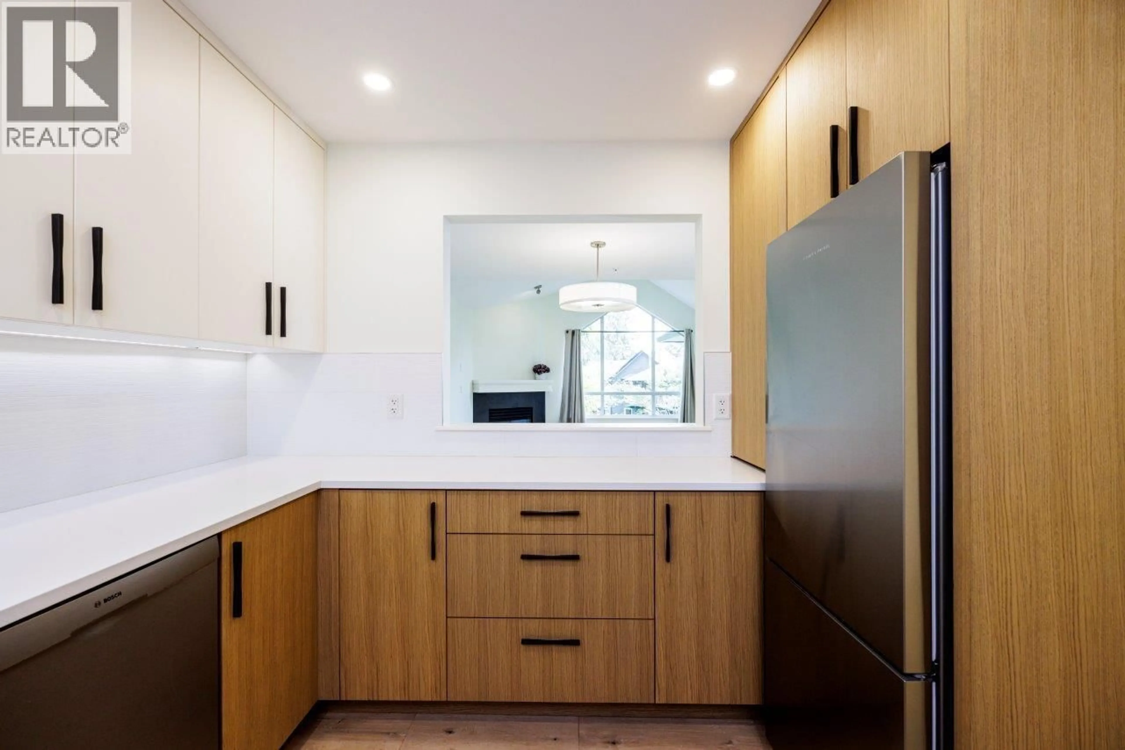 Contemporary kitchen, wood/laminate floor for 302 - 1133 29TH STREET, North Vancouver British Columbia V7K1C3