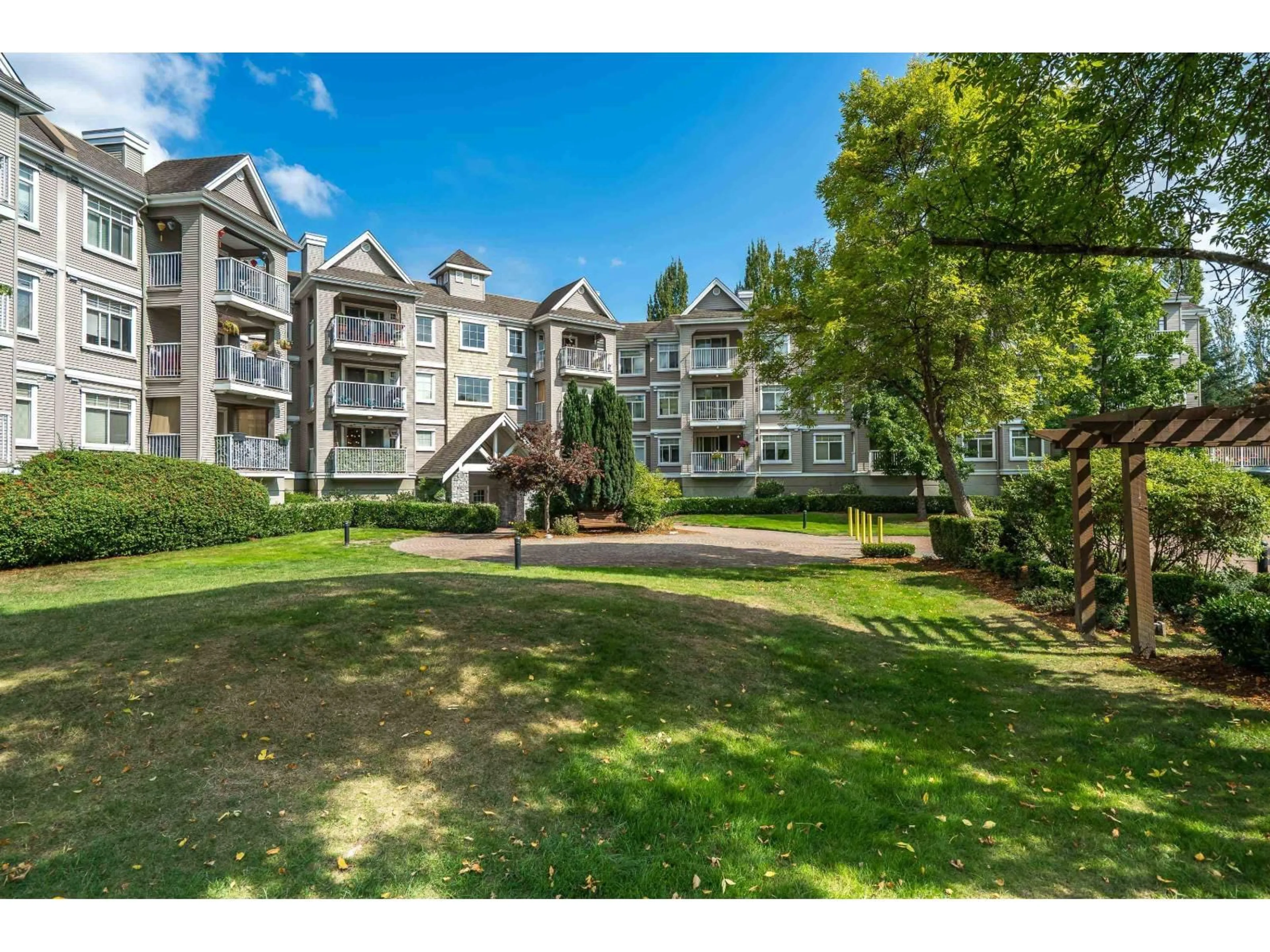 A pic from outside/outdoor area/front of a property/back of a property/a pic from drone, mountain view for 101 - 20896 57, Langley British Columbia V3A8S9