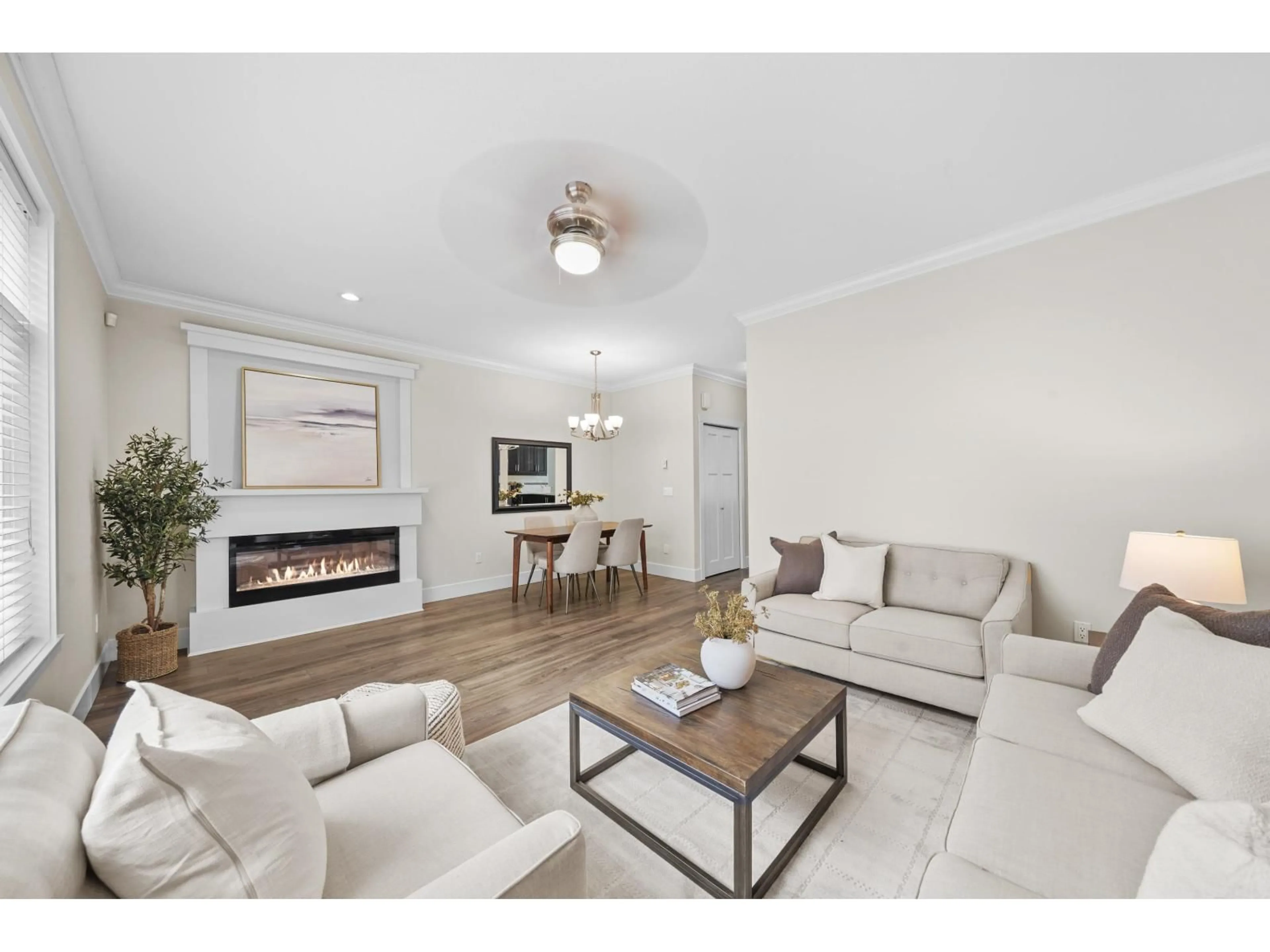 Living room with furniture, wood/laminate floor for 123 15399 GUILDFORD, Surrey British Columbia V3R7C6