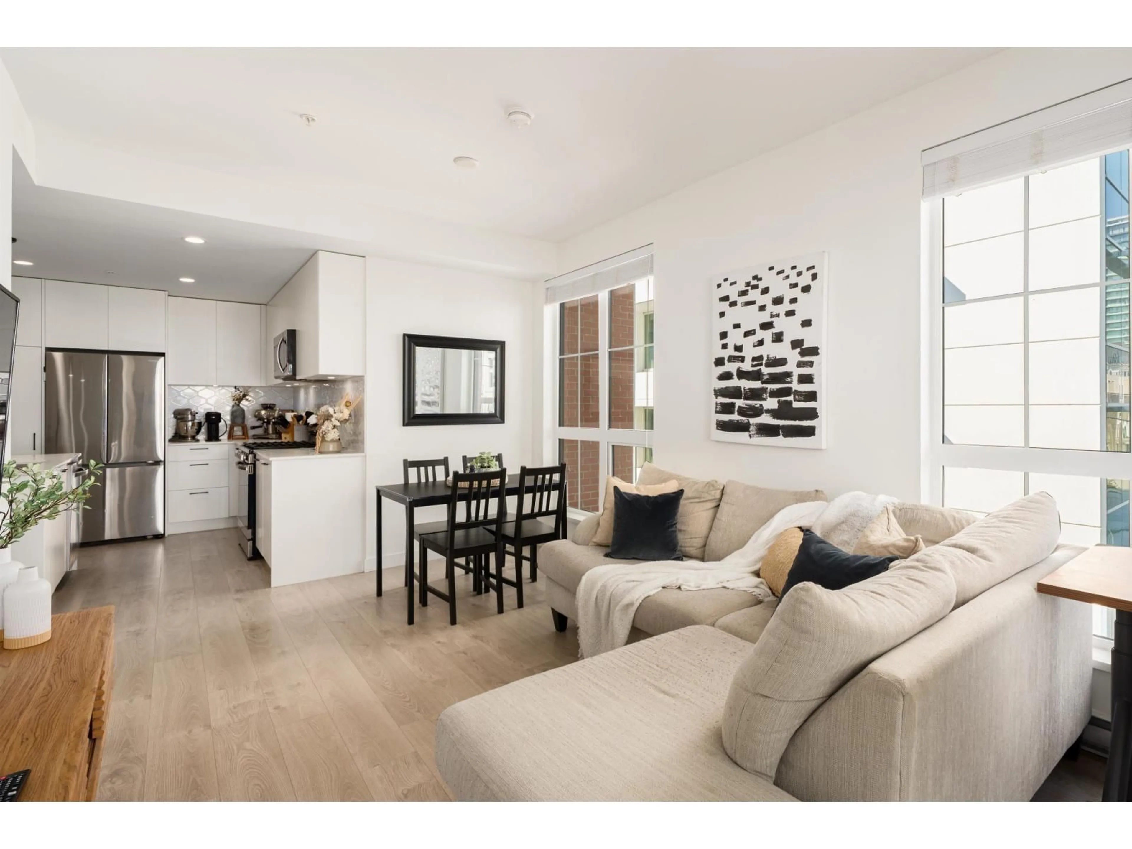 Living room with furniture, wood/laminate floor for 307 - 8353 200A, Langley British Columbia V2Y5K7