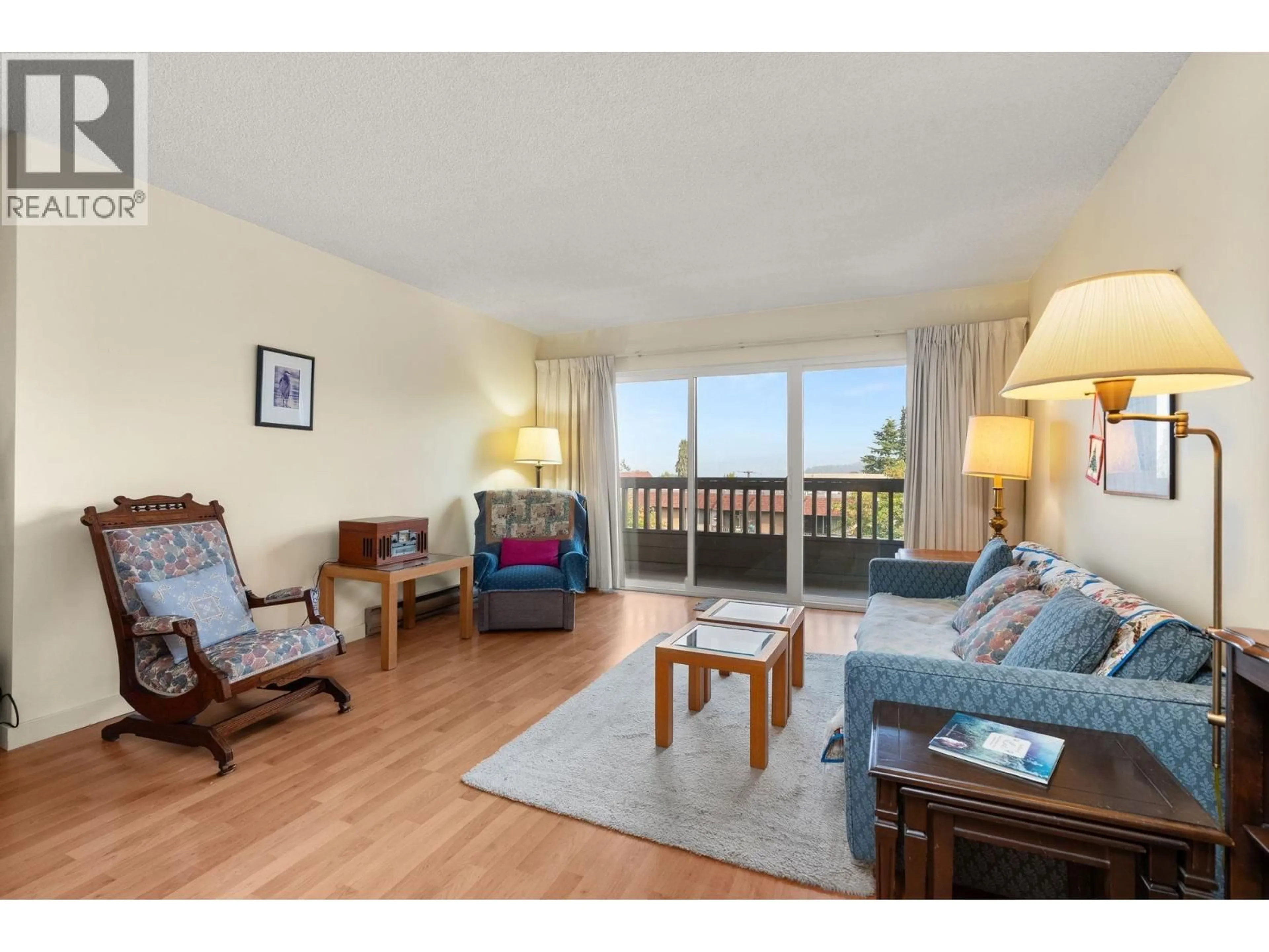 Living room with furniture, wood/laminate floor for 305 - 2100 3RD AVENUE, Vancouver British Columbia V6K1L1