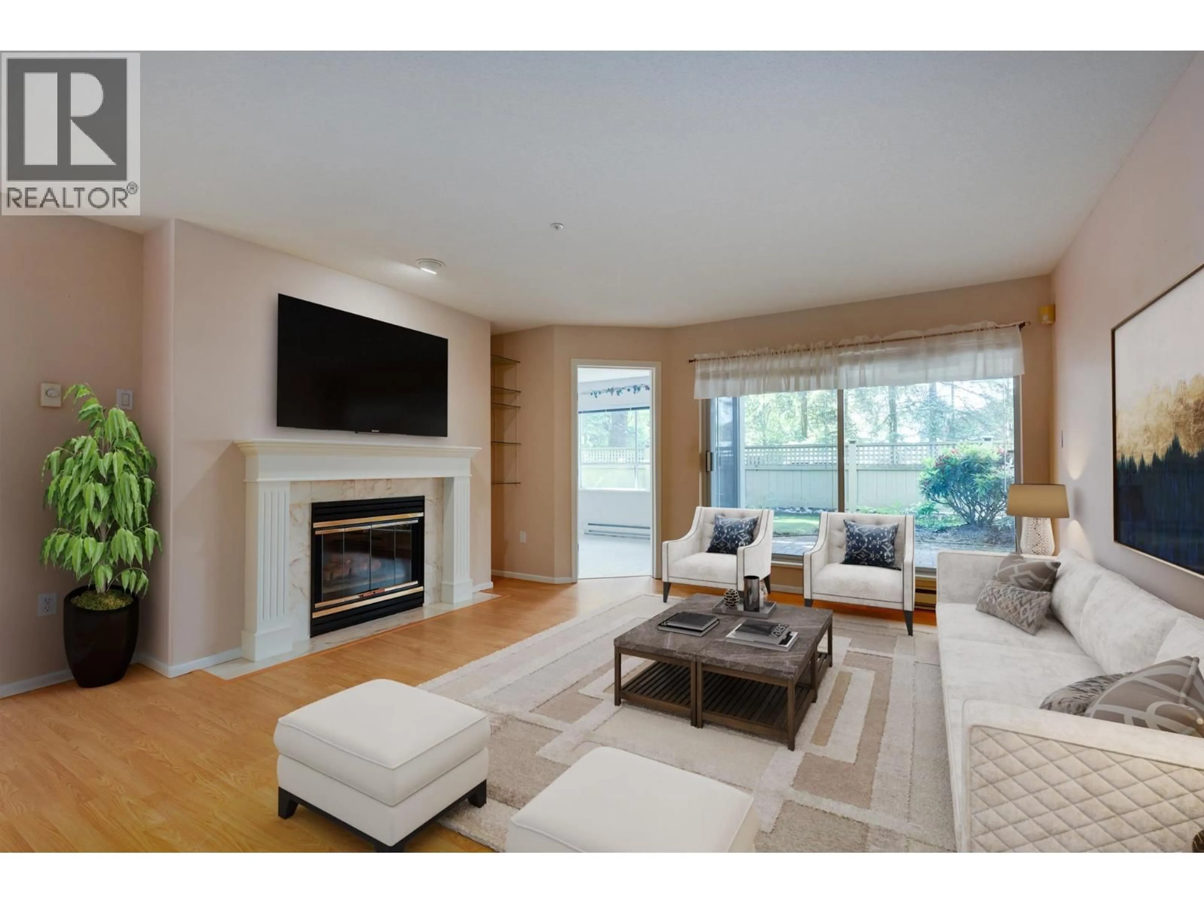Living room with furniture, wood/laminate floor for 104 - 3690 BANFF COURT, North Vancouver British Columbia V7H2Y7