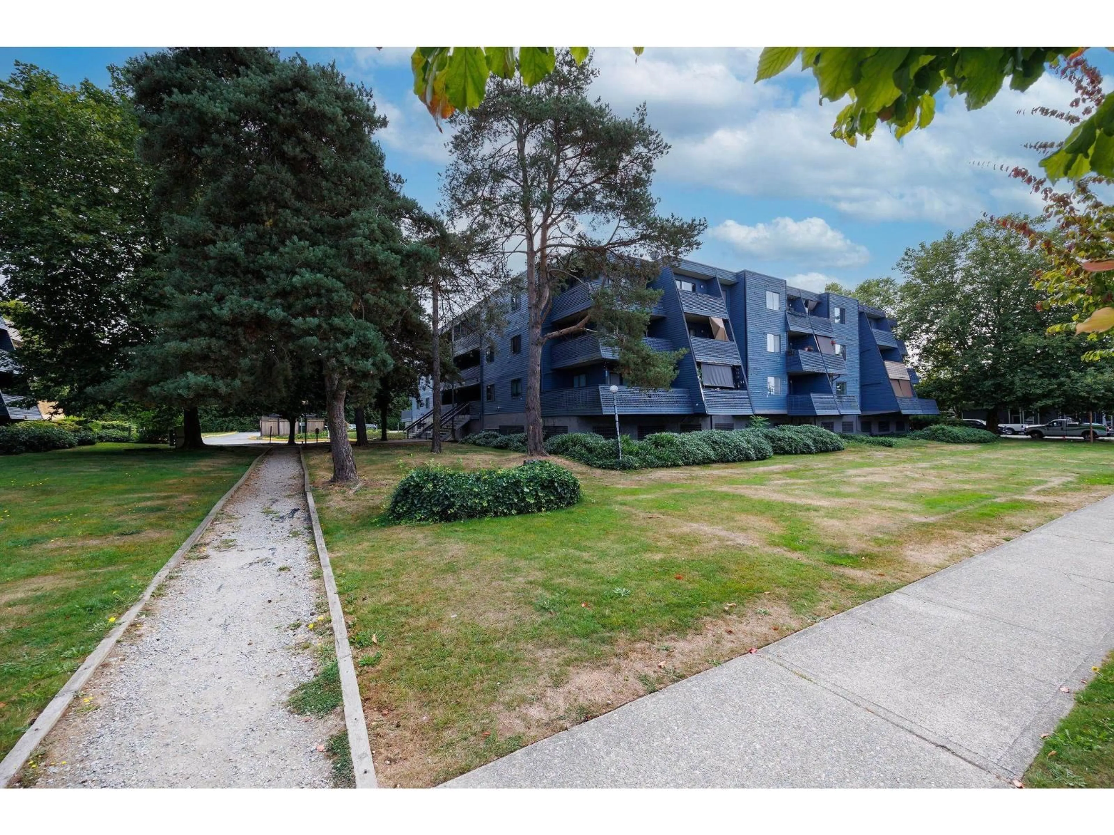 A pic from outside/outdoor area/front of a property/back of a property/a pic from drone, unknown for 207 - 17661 58A, Surrey British Columbia V3S1N4