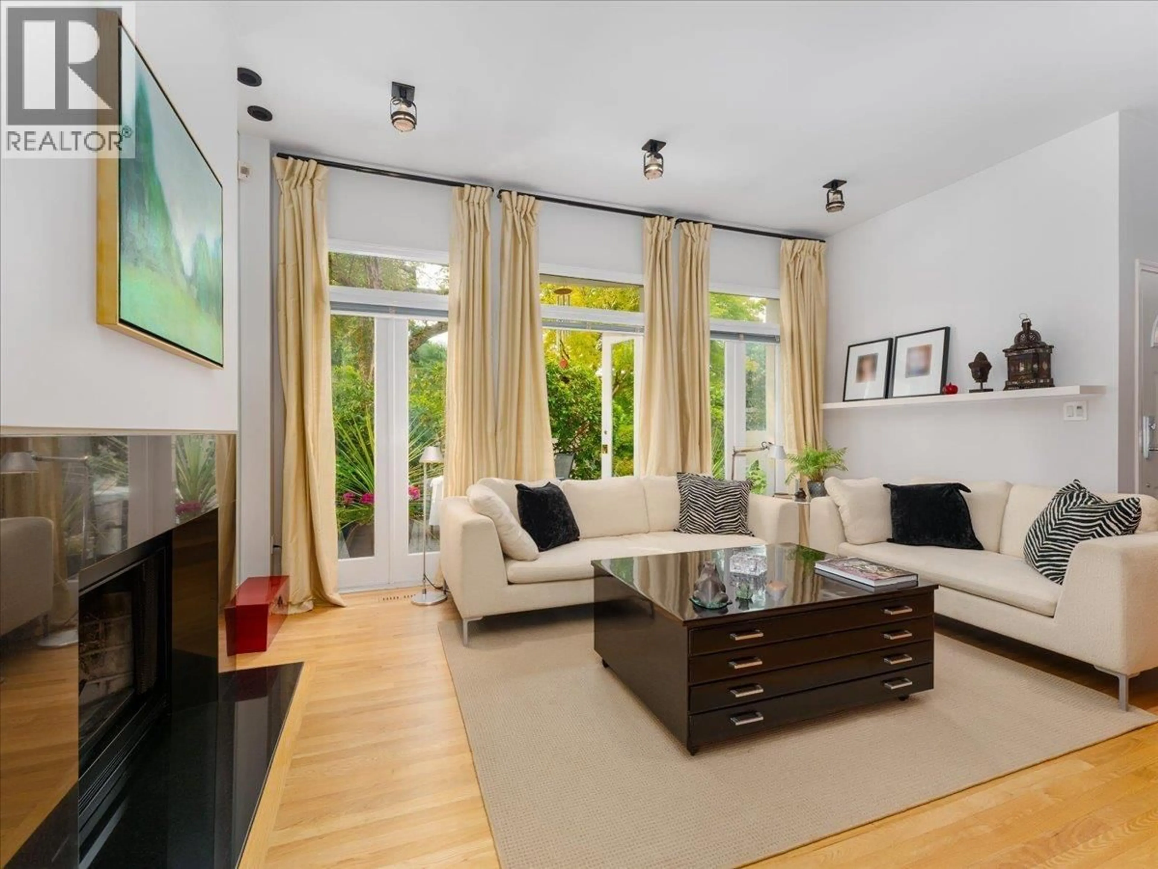 Living room with furniture, wood/laminate floor for 1973 WHYTE AVENUE, Vancouver British Columbia V6J1B4