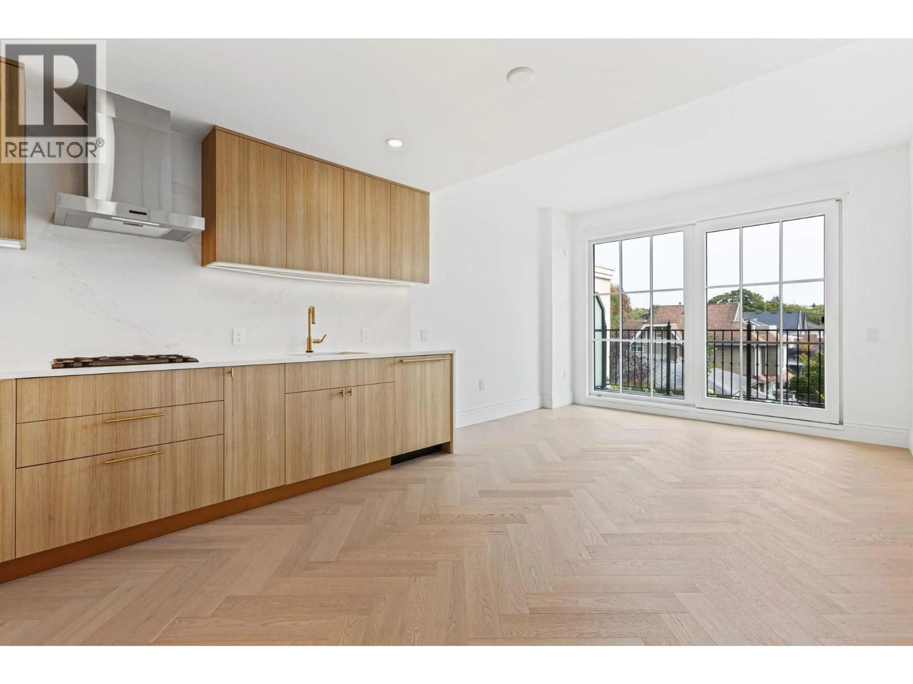 Open concept kitchen, wood/laminate floor for 302 - 2096 47TH AVENUE, Vancouver British Columbia V6M0E5
