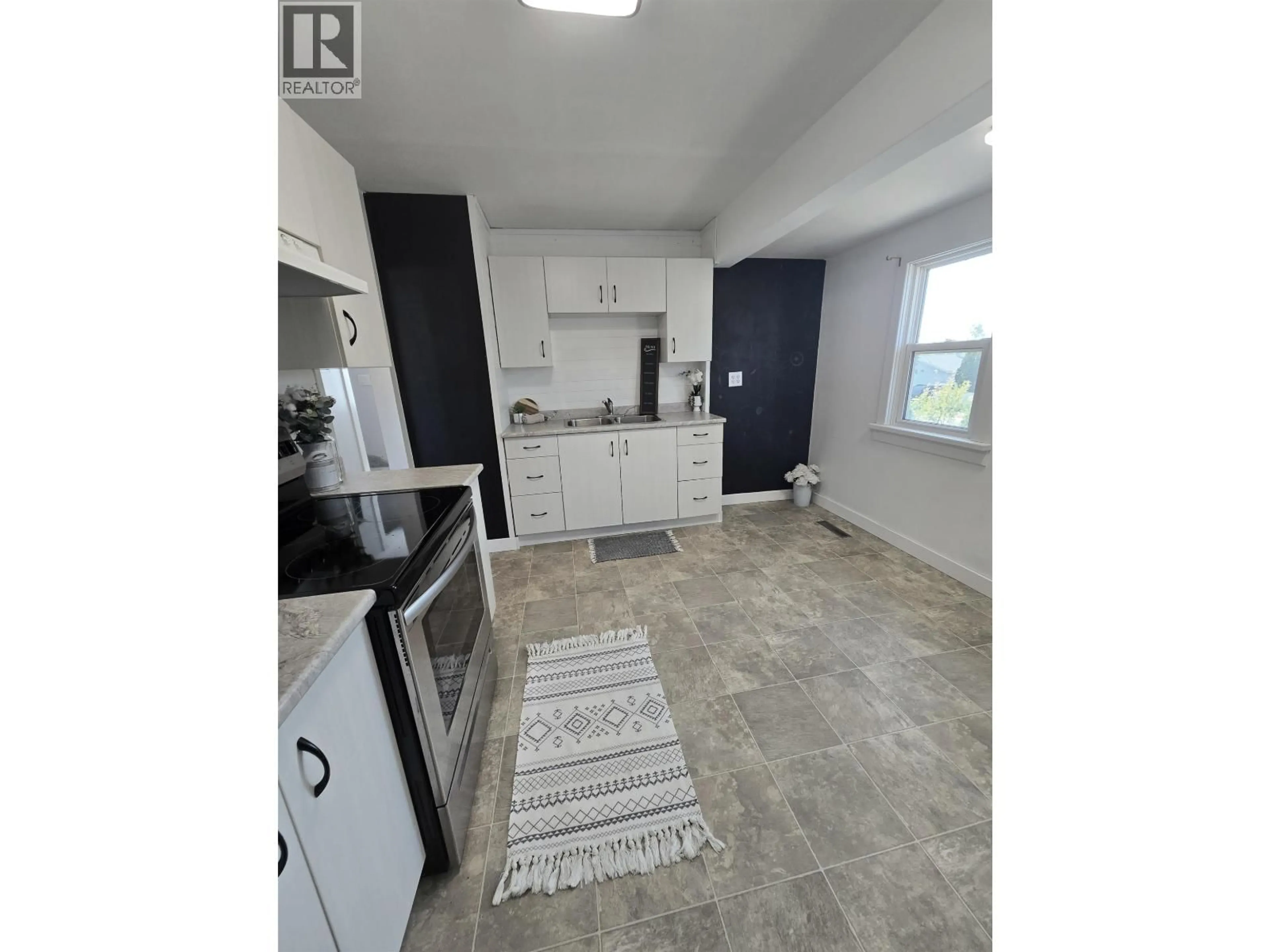 Open concept kitchen, ceramic/tile floor for 9423 99 AVENUE, Fort St. John British Columbia V1J1T3
