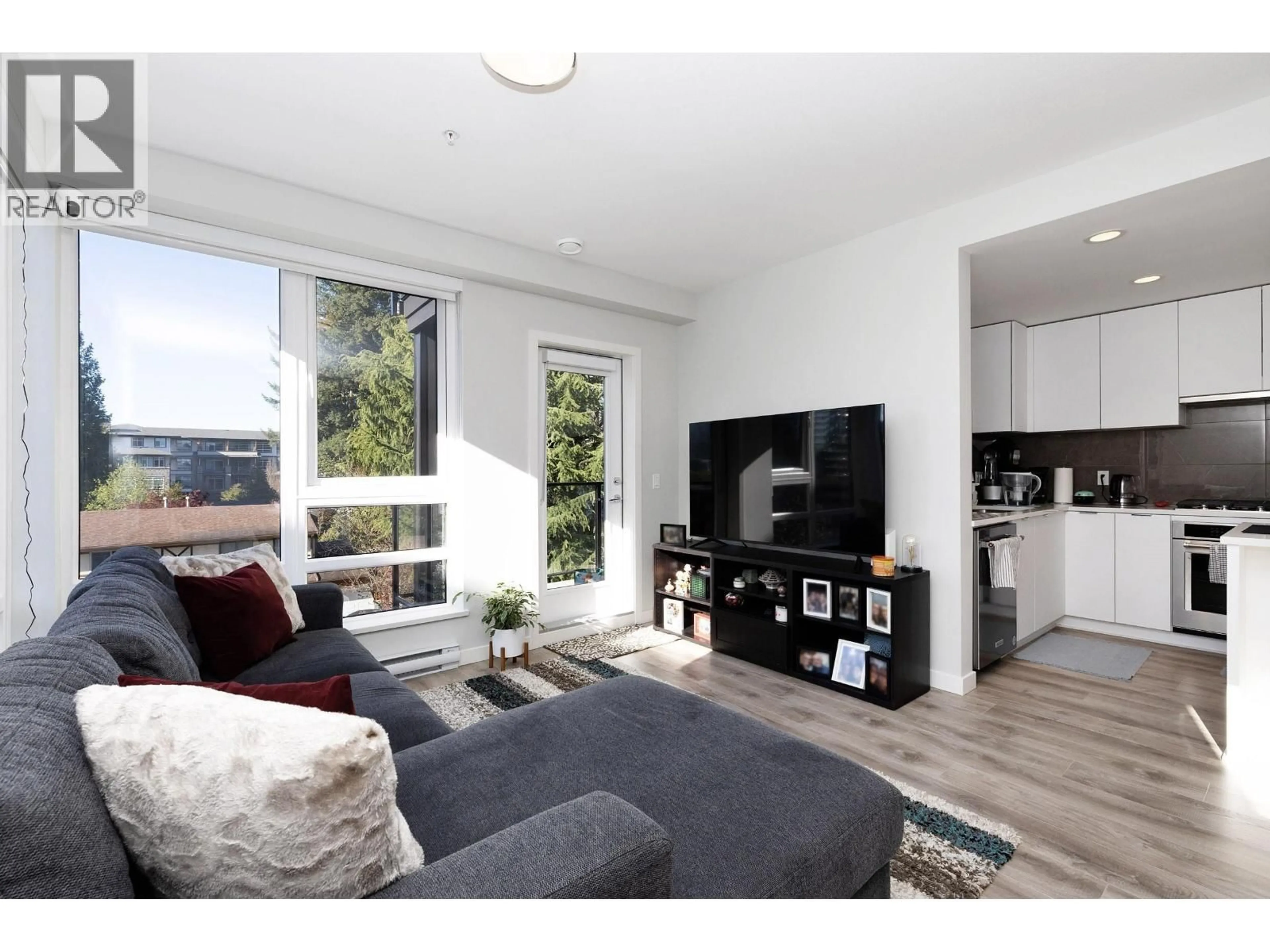 Living room with furniture, wood/laminate floor for 404 - 615 COTTONWOOD AVENUE, Coquitlam British Columbia V3J2S5