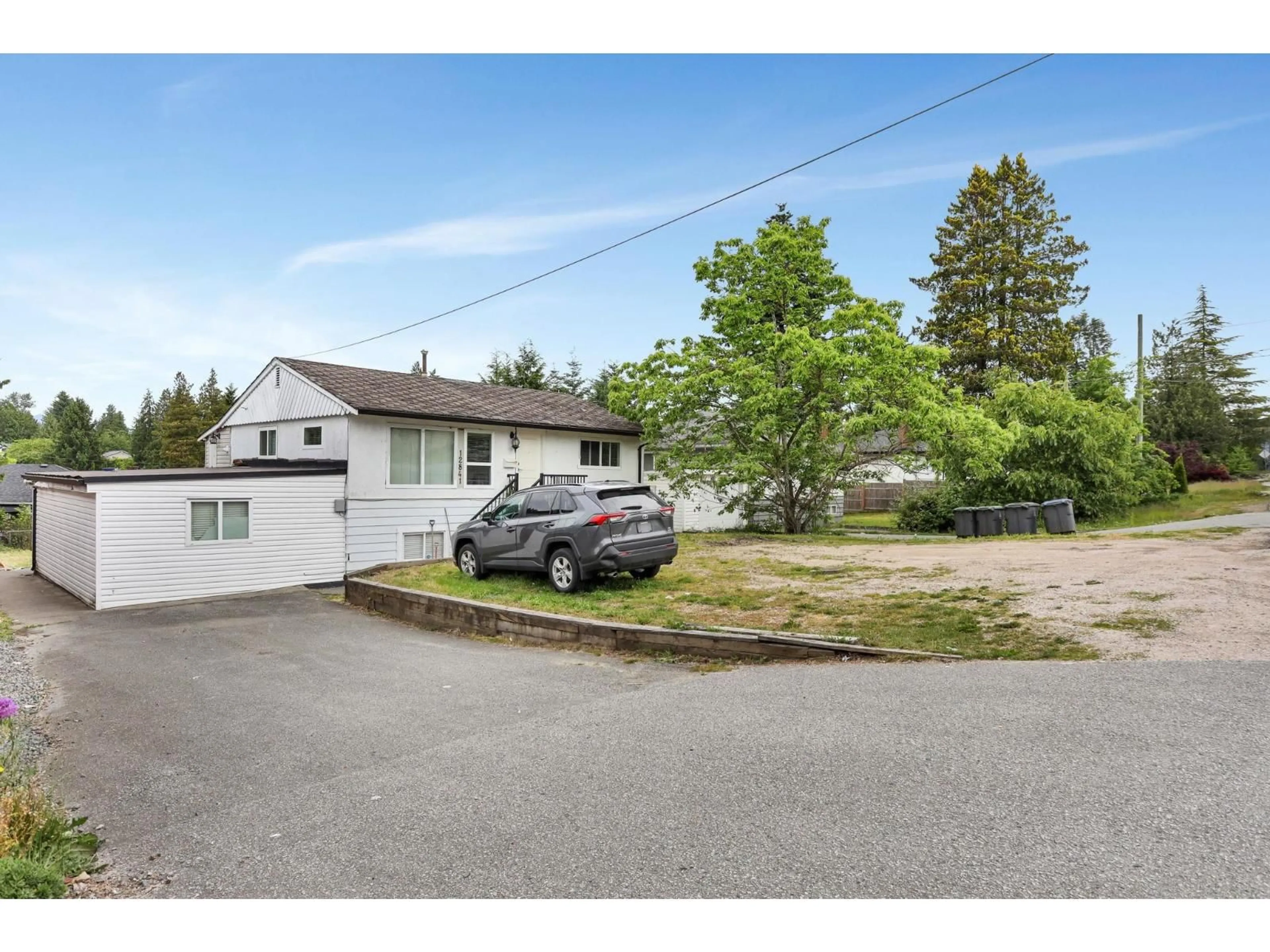 A pic from outside/outdoor area/front of a property/back of a property/a pic from drone, street for 12841 98, Surrey British Columbia V3T1B1