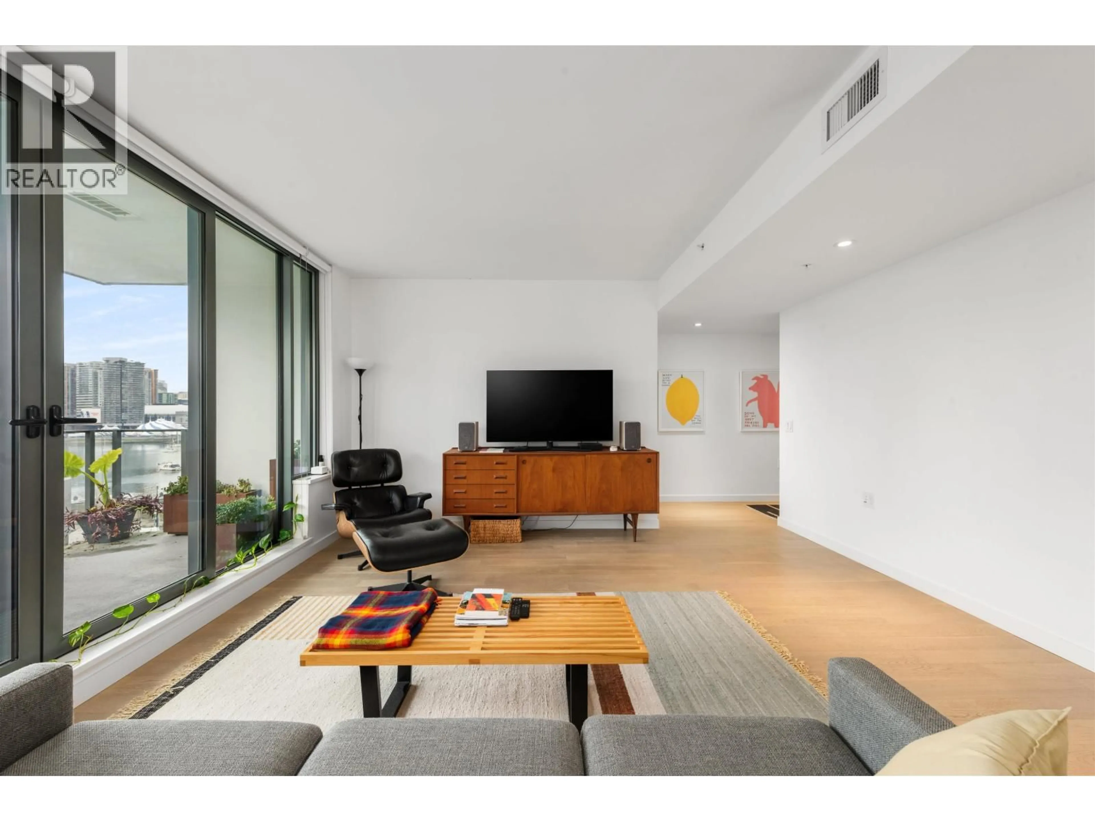 Living room with furniture, wood/laminate floor for 903 - 1678 PULLMAN PORTER STREET, Vancouver British Columbia V6A0H4
