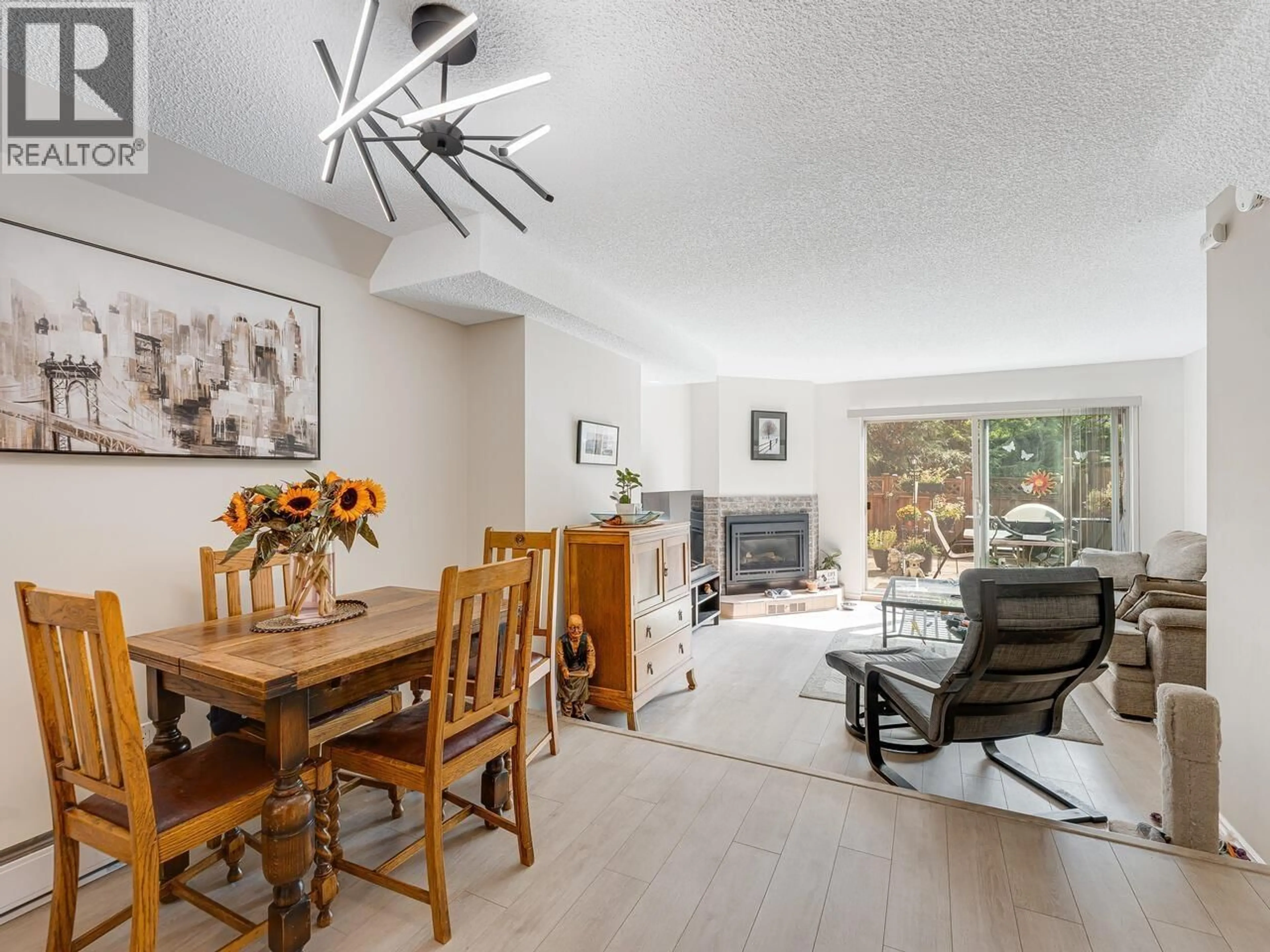 Living room with furniture, wood/laminate floor for 8132 LAVAL PLACE, Vancouver British Columbia V5S4B2