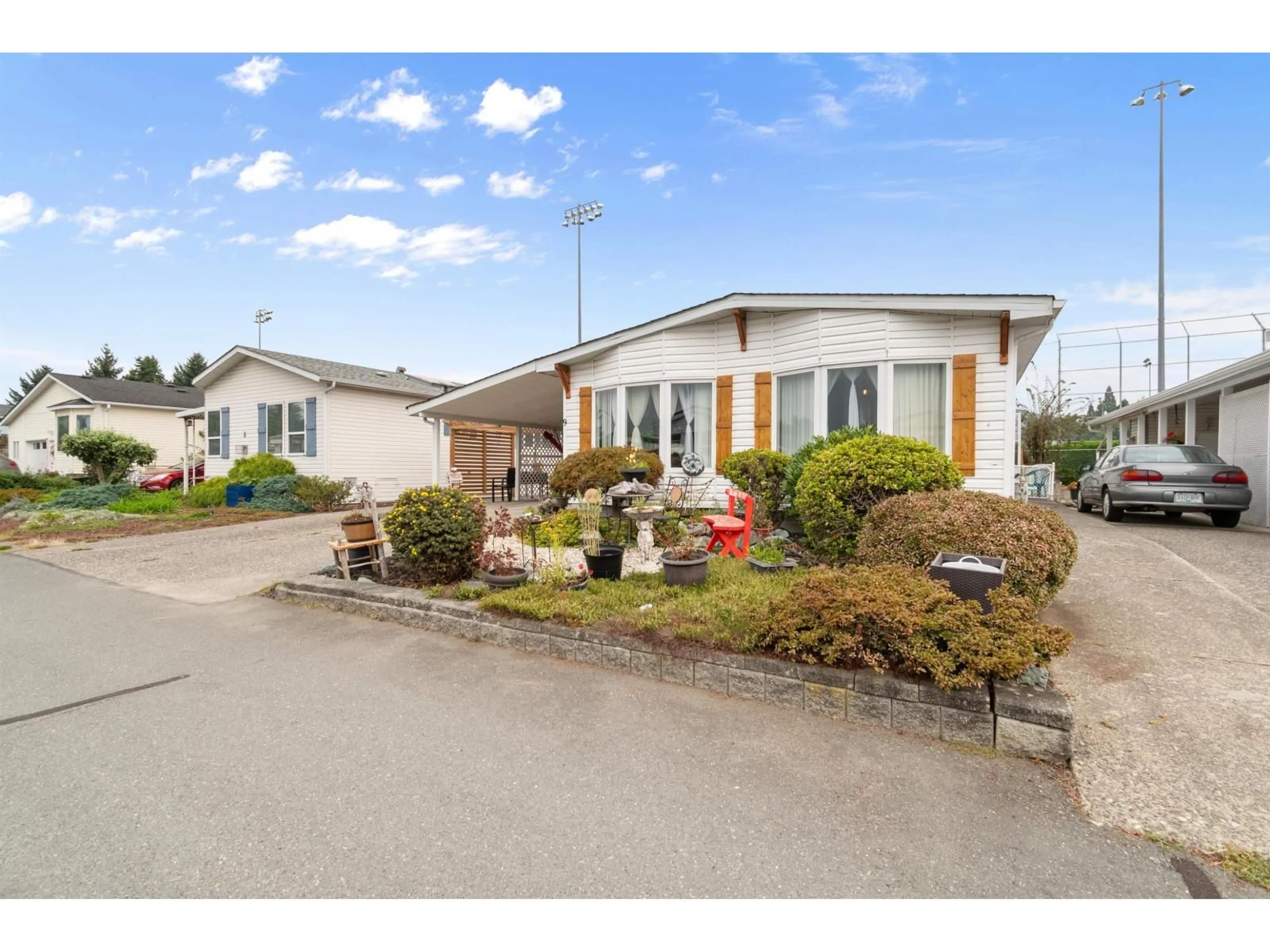 A pic from outside/outdoor area/front of a property/back of a property/a pic from drone, street for 9 - 9055 ASHWELL ROAD, Chilliwack British Columbia V2P7S6