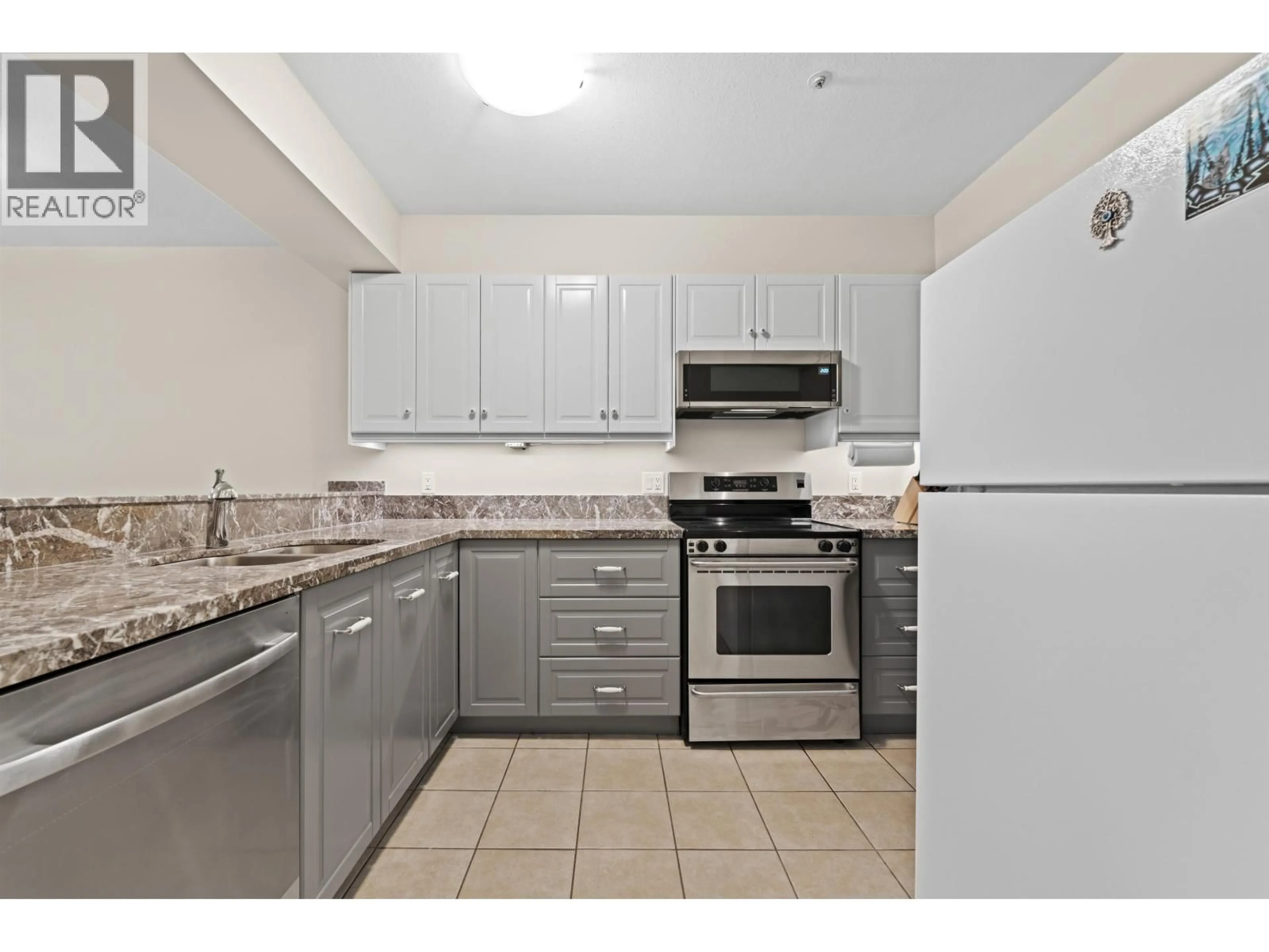Standard kitchen, ceramic/tile floor for 101 - 1615 FRANCES STREET, Vancouver British Columbia V5L1Z3