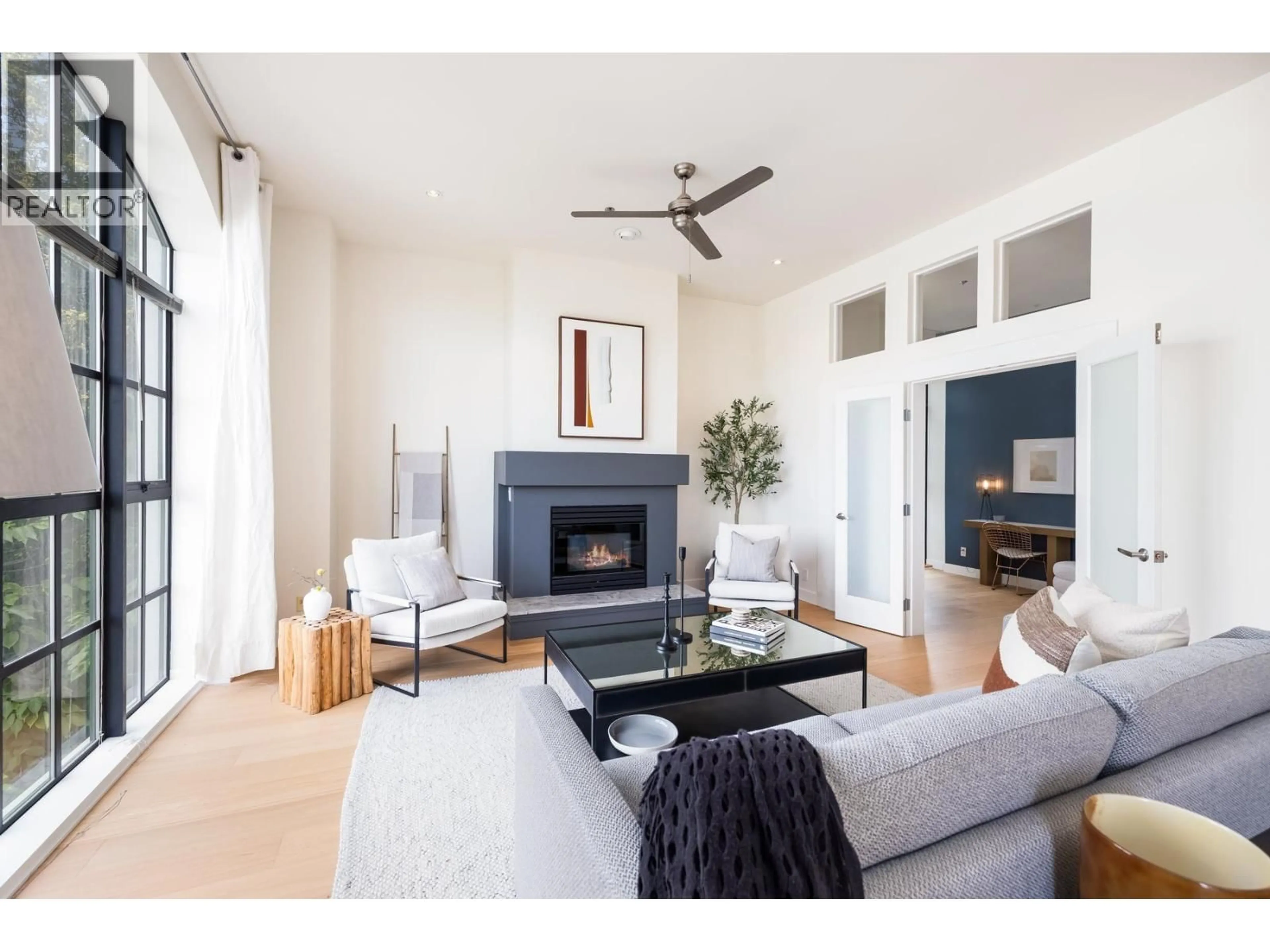 Living room with furniture, wood/laminate floor for 202 - 4590 EARLES STREET, Vancouver British Columbia V5R6A2