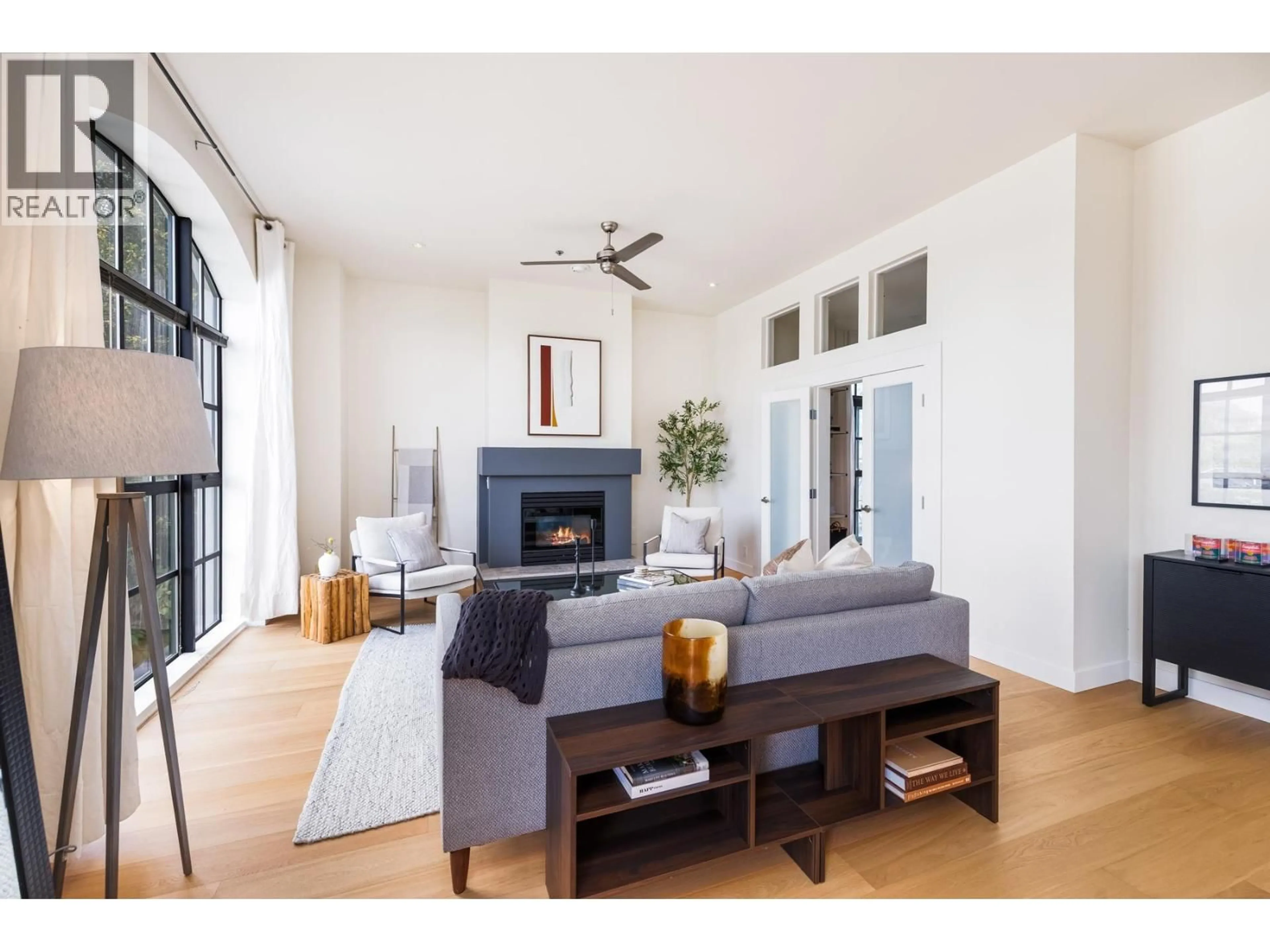 Living room with furniture, wood/laminate floor for 202 - 4590 EARLES STREET, Vancouver British Columbia V5R6A2