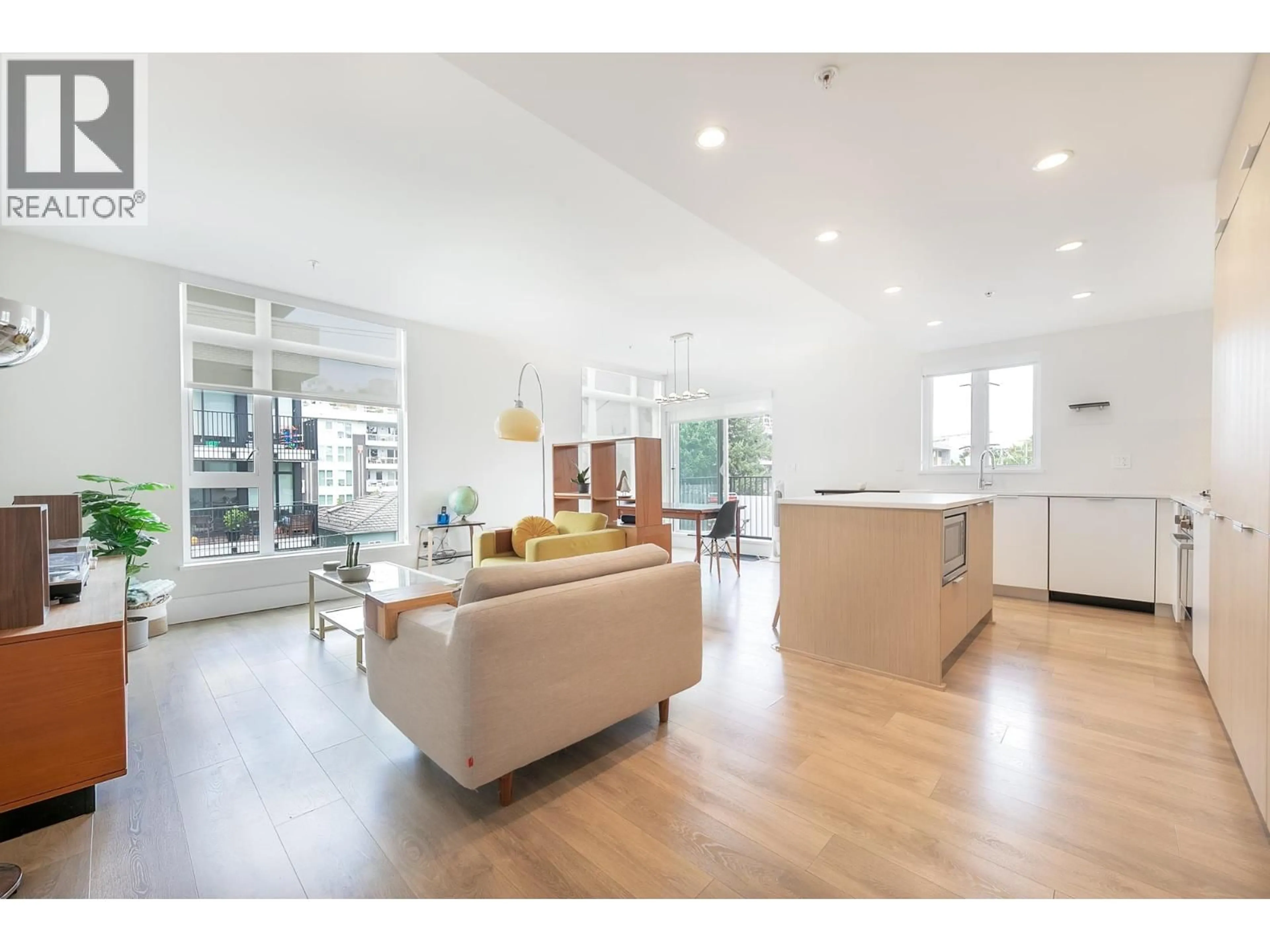 Open concept kitchen, wood/laminate floor for 308 - 5085 MAIN STREET, Vancouver British Columbia V5W2R2