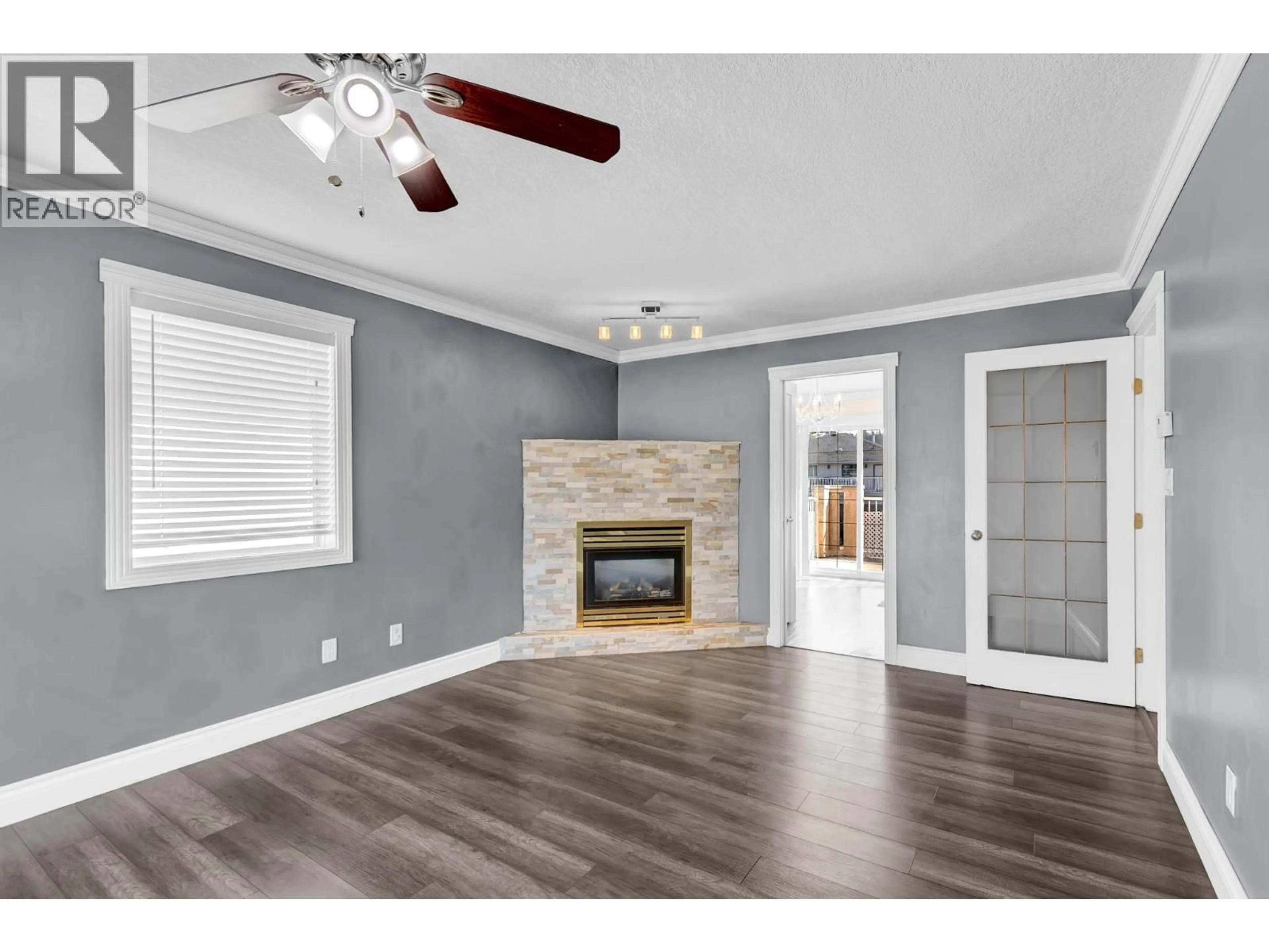 Living room with furniture, wood/laminate floor for 2764 MERRITT ROAD, Prince George British Columbia V2N1M4