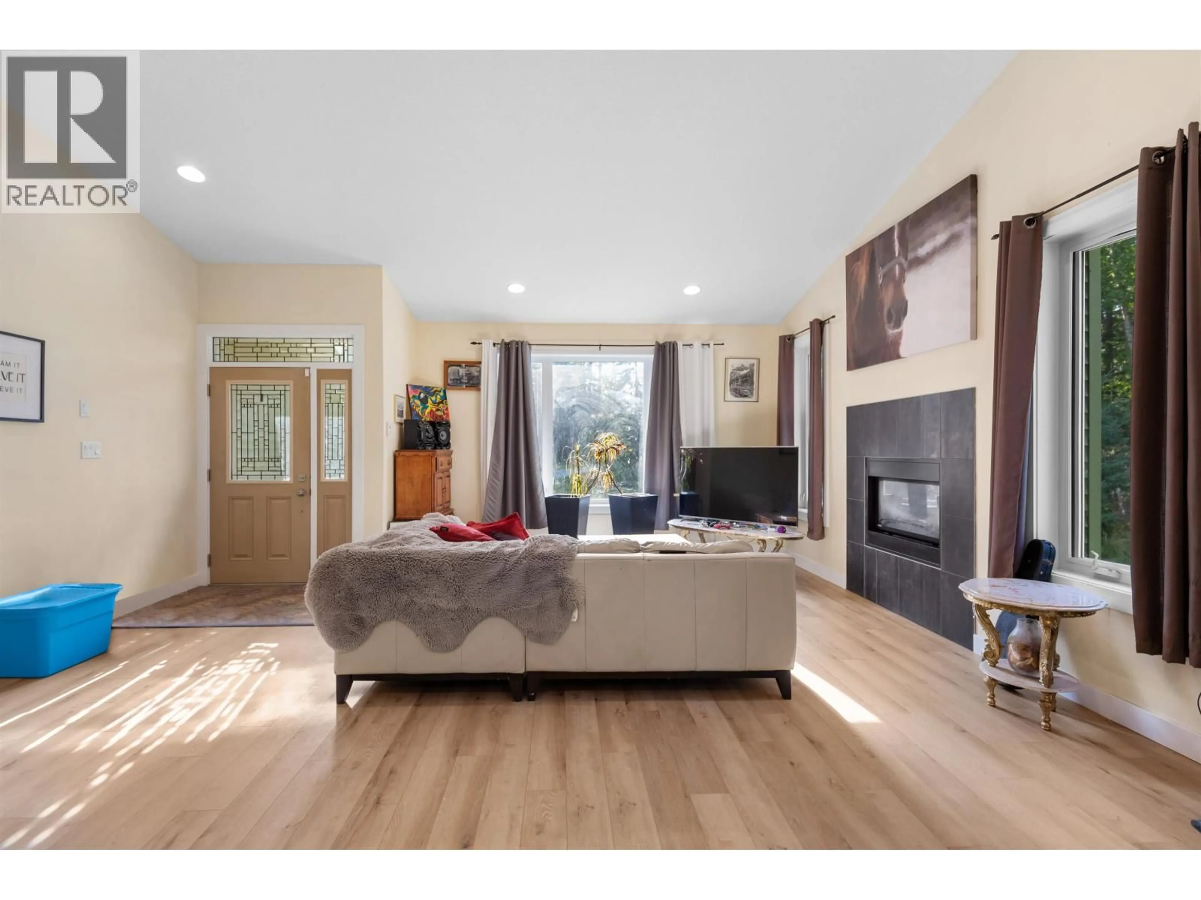 Living room with furniture, wood/laminate floor for 12470 KELLY ROAD, Prince George British Columbia V2K5V6