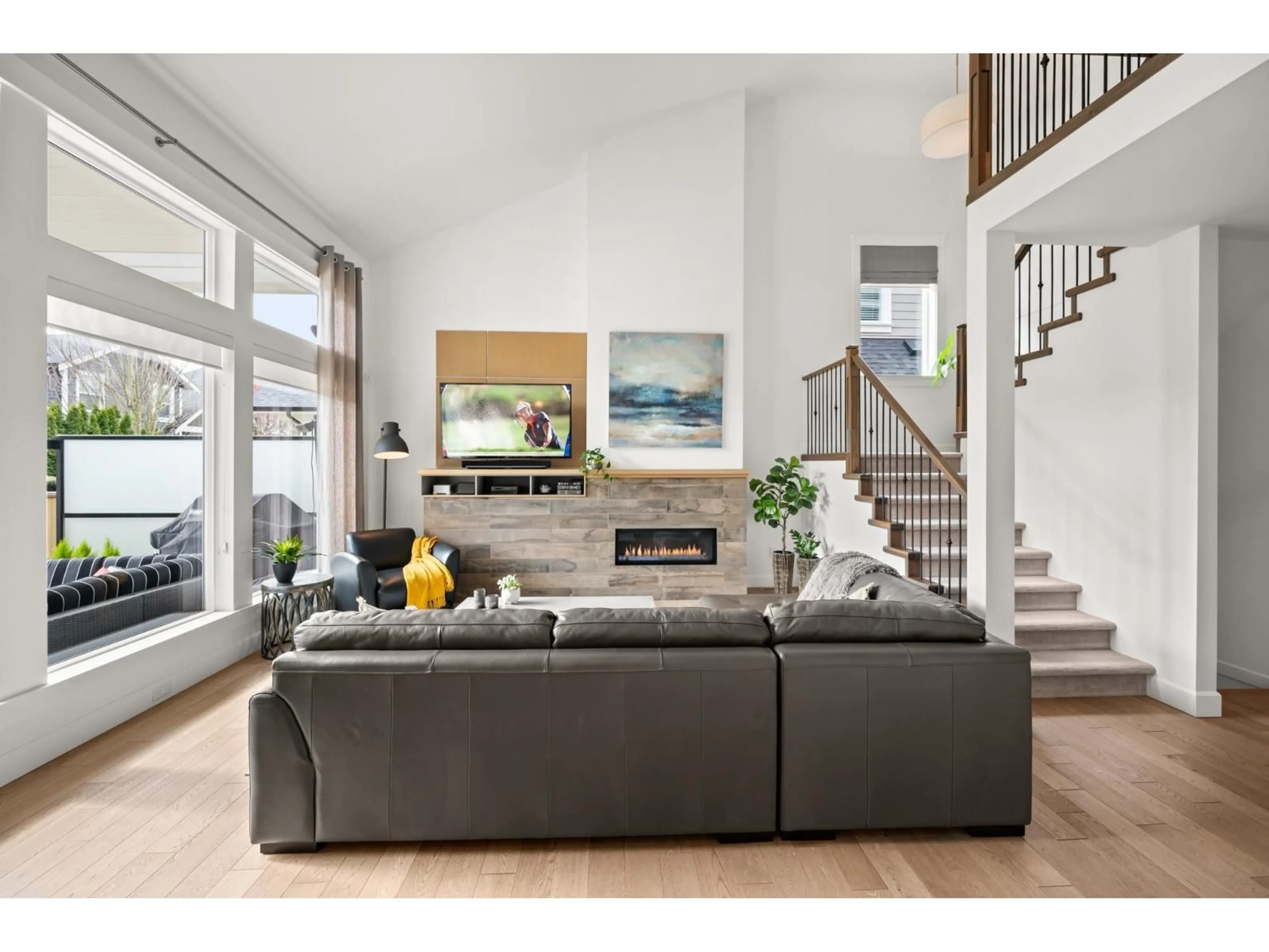 Living room with furniture, wood/laminate floor for 16758 22A, Surrey British Columbia V3Z0M7