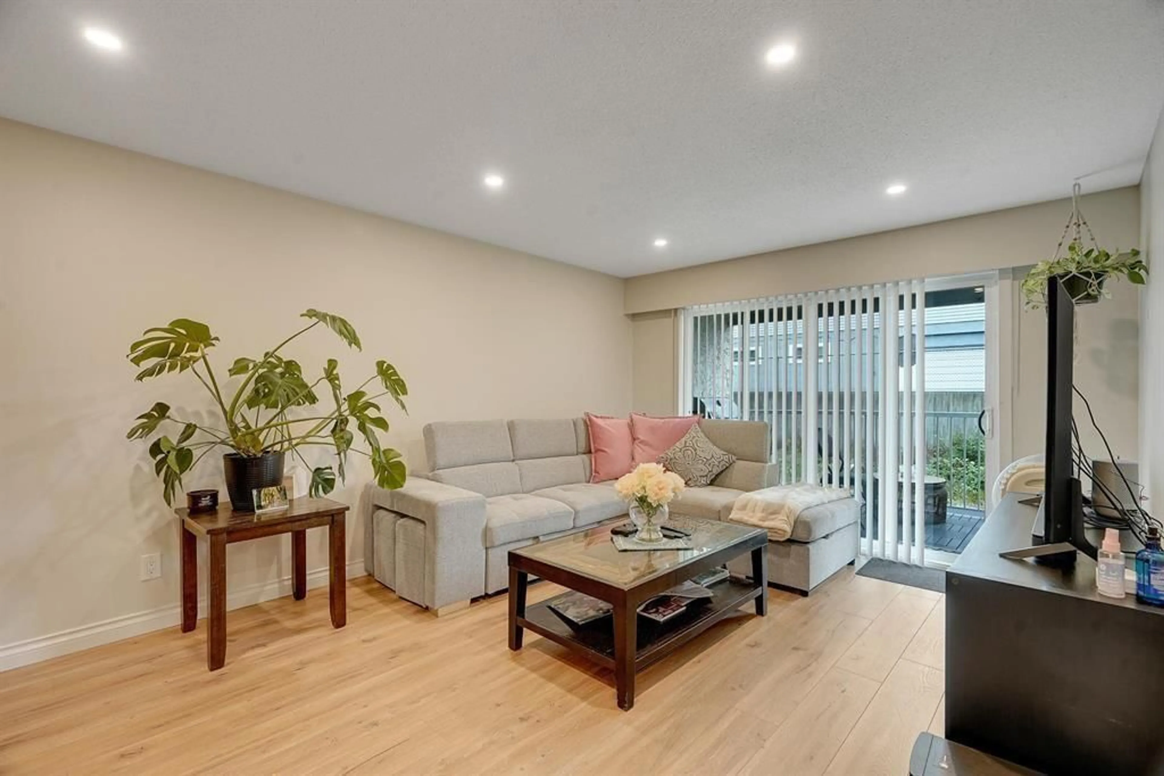 Living room with furniture, wood/laminate floor for 121 - 32850 GEORGE FERGUSON, Abbotsford British Columbia V2S7K1