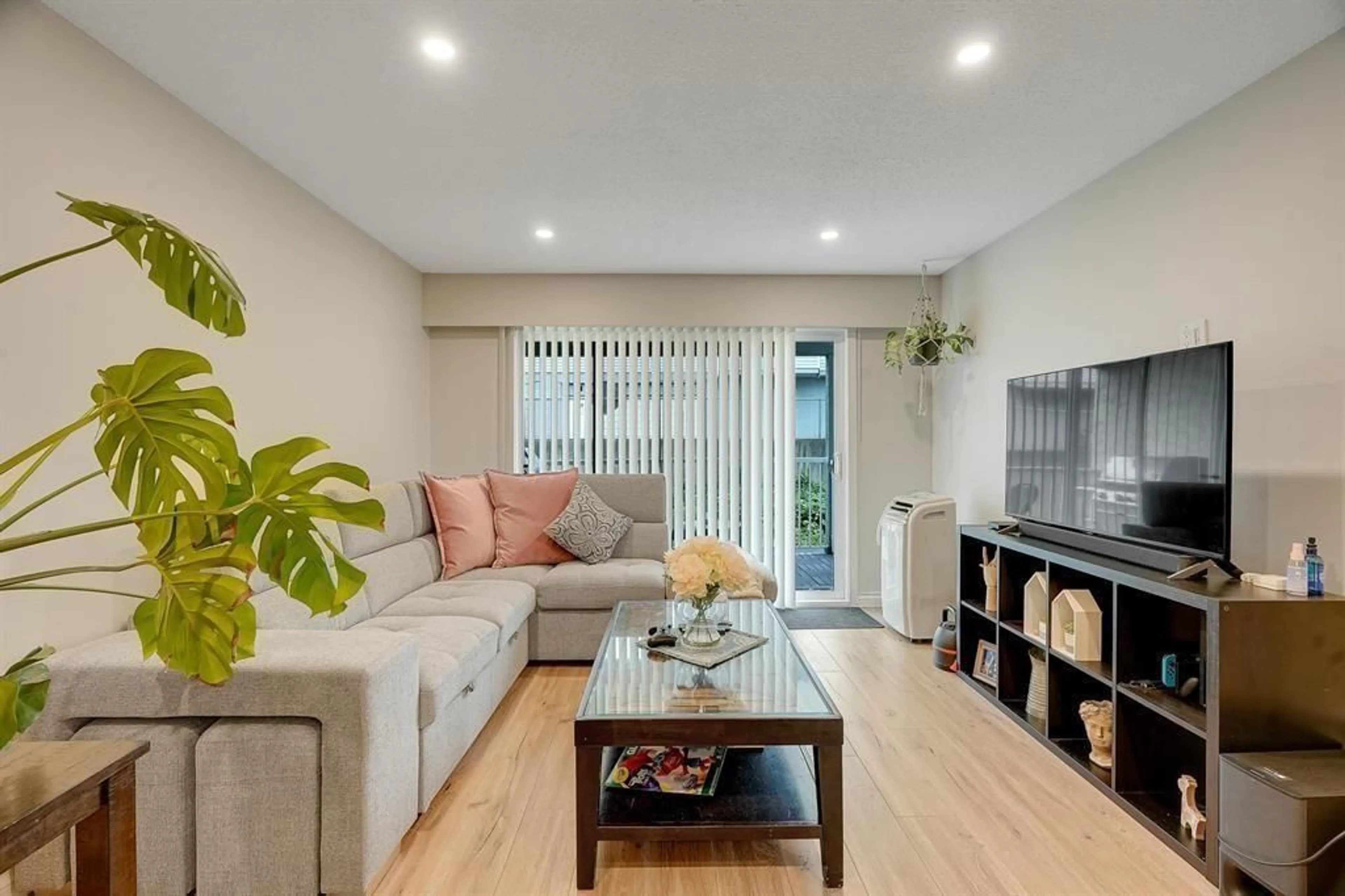 Living room with furniture, wood/laminate floor for 121 - 32850 GEORGE FERGUSON, Abbotsford British Columbia V2S7K1