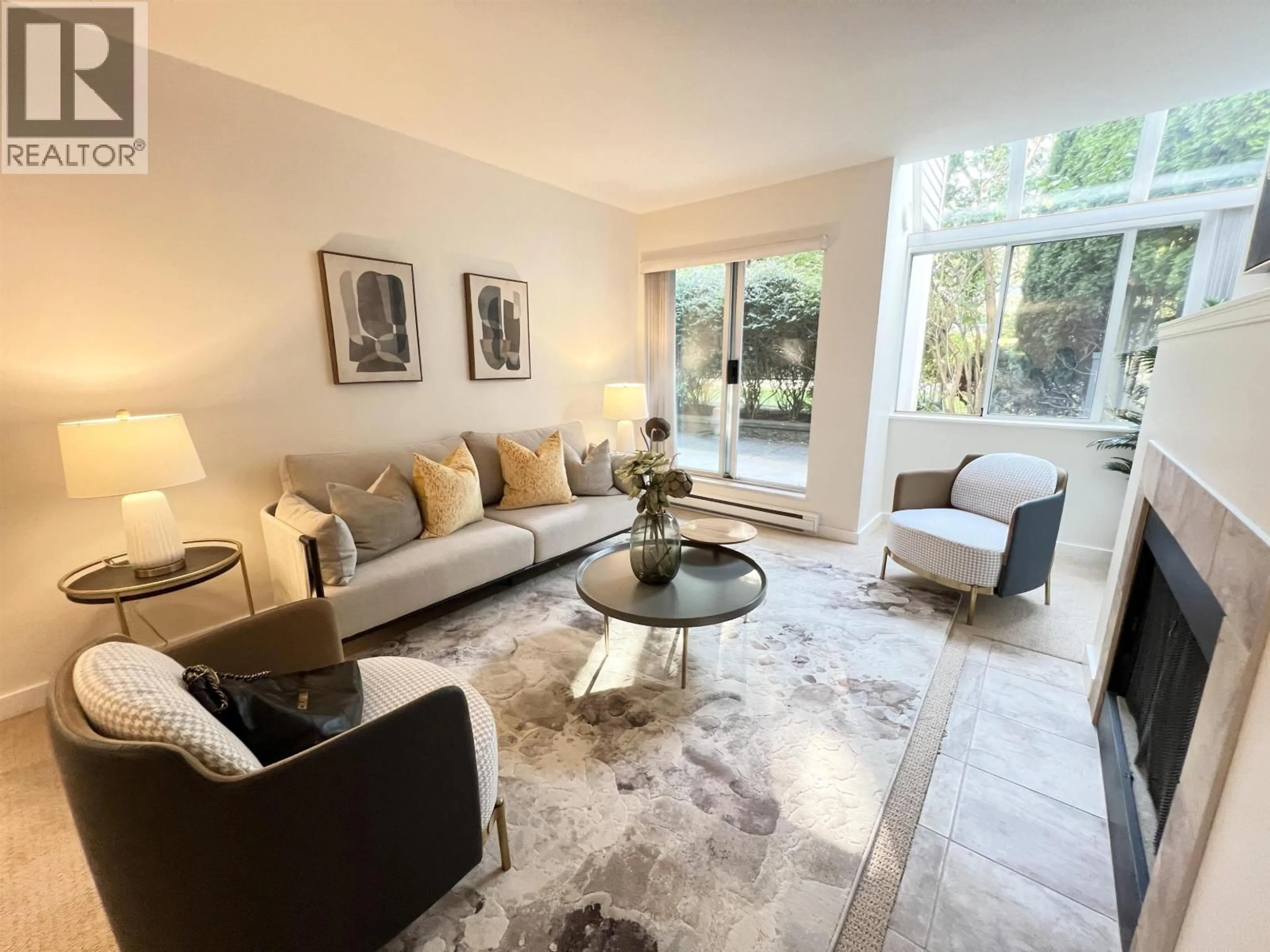 Living room with furniture, unknown for 102 - 7471 BLUNDELL ROAD, Richmond British Columbia V6Y1J6