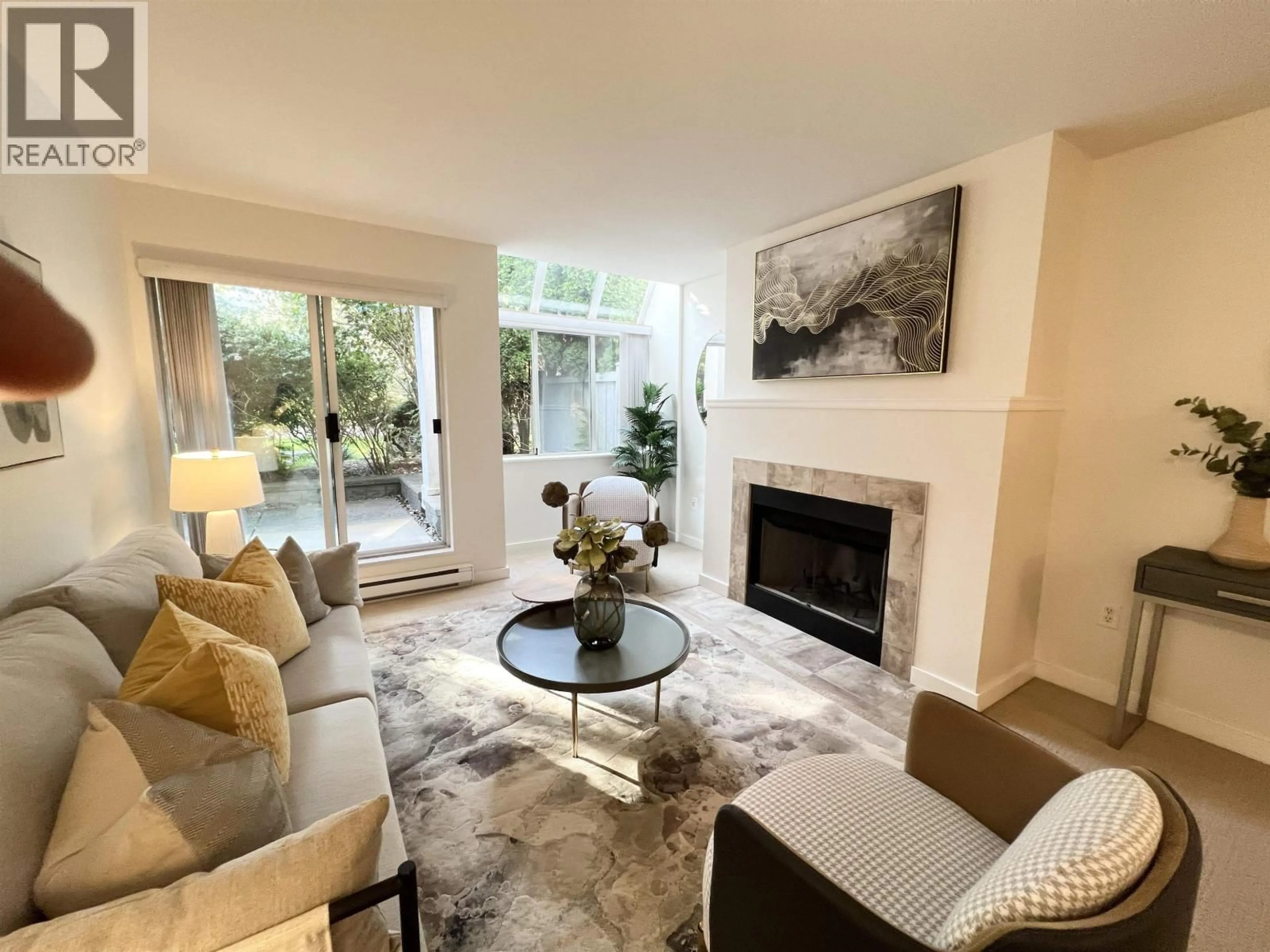 Living room with furniture, unknown for 102 - 7471 BLUNDELL ROAD, Richmond British Columbia V6Y1J6