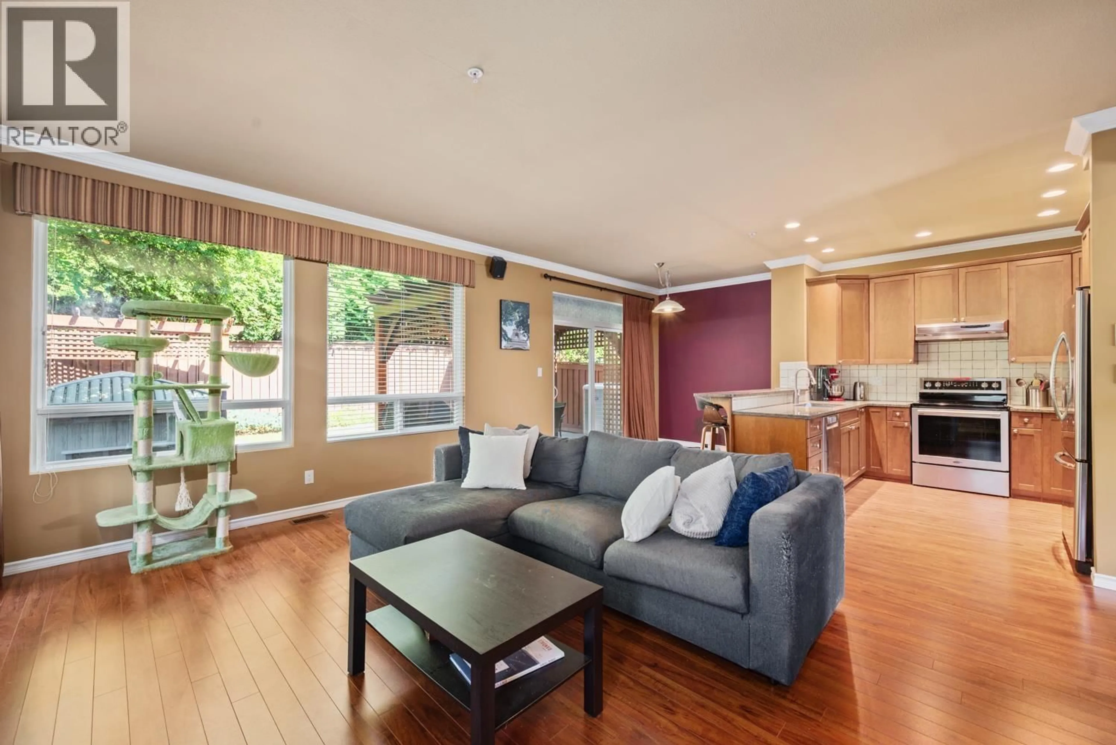 Living room with furniture, wood/laminate floor for 10 - 2381 ARGUE STREET, Port Coquitlam British Columbia V3C6P9