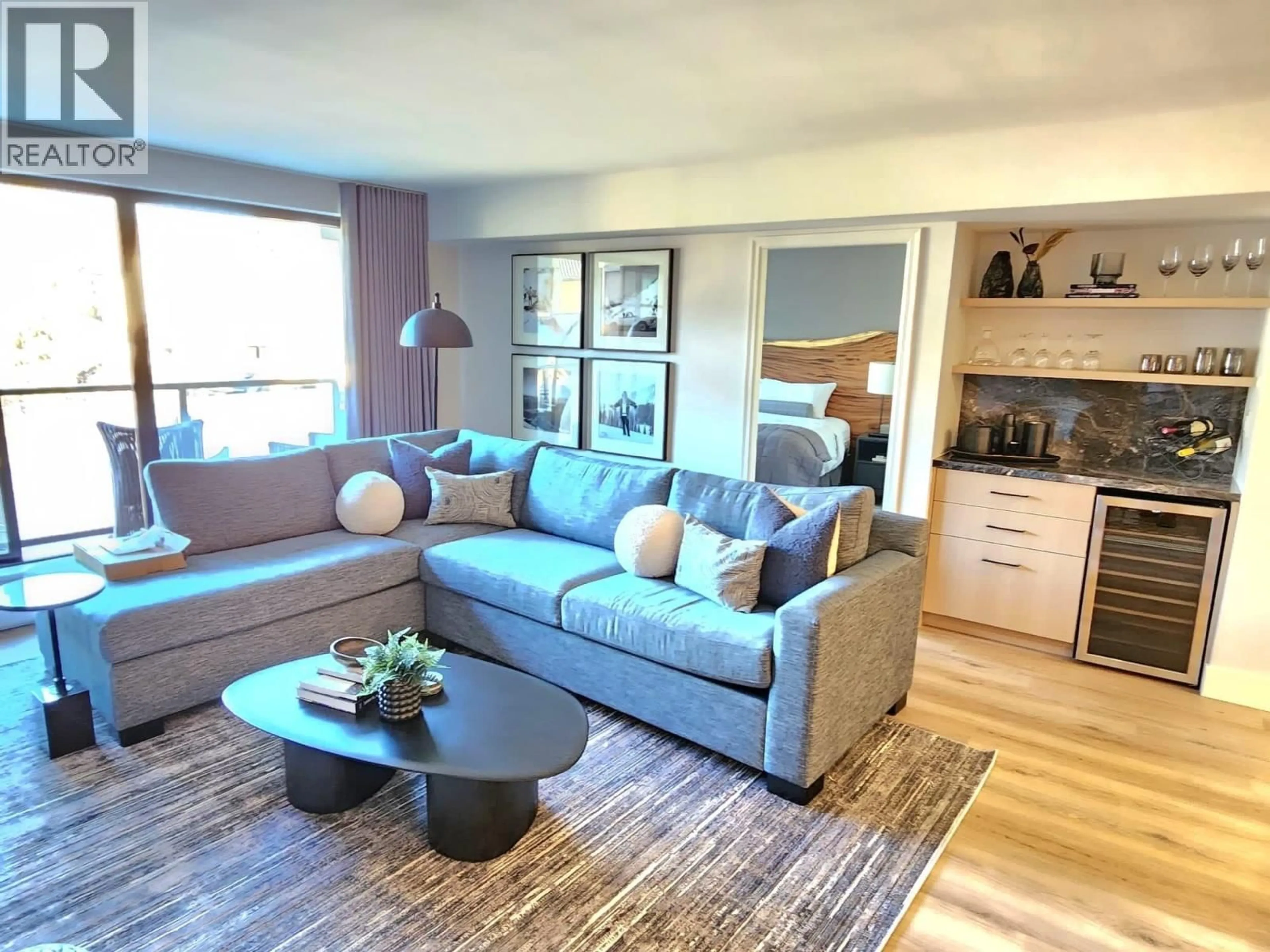 Living room with furniture, wood/laminate floor for 307 - 4280 MOUNTAIN SQUARE, Whistler British Columbia V8E1B9