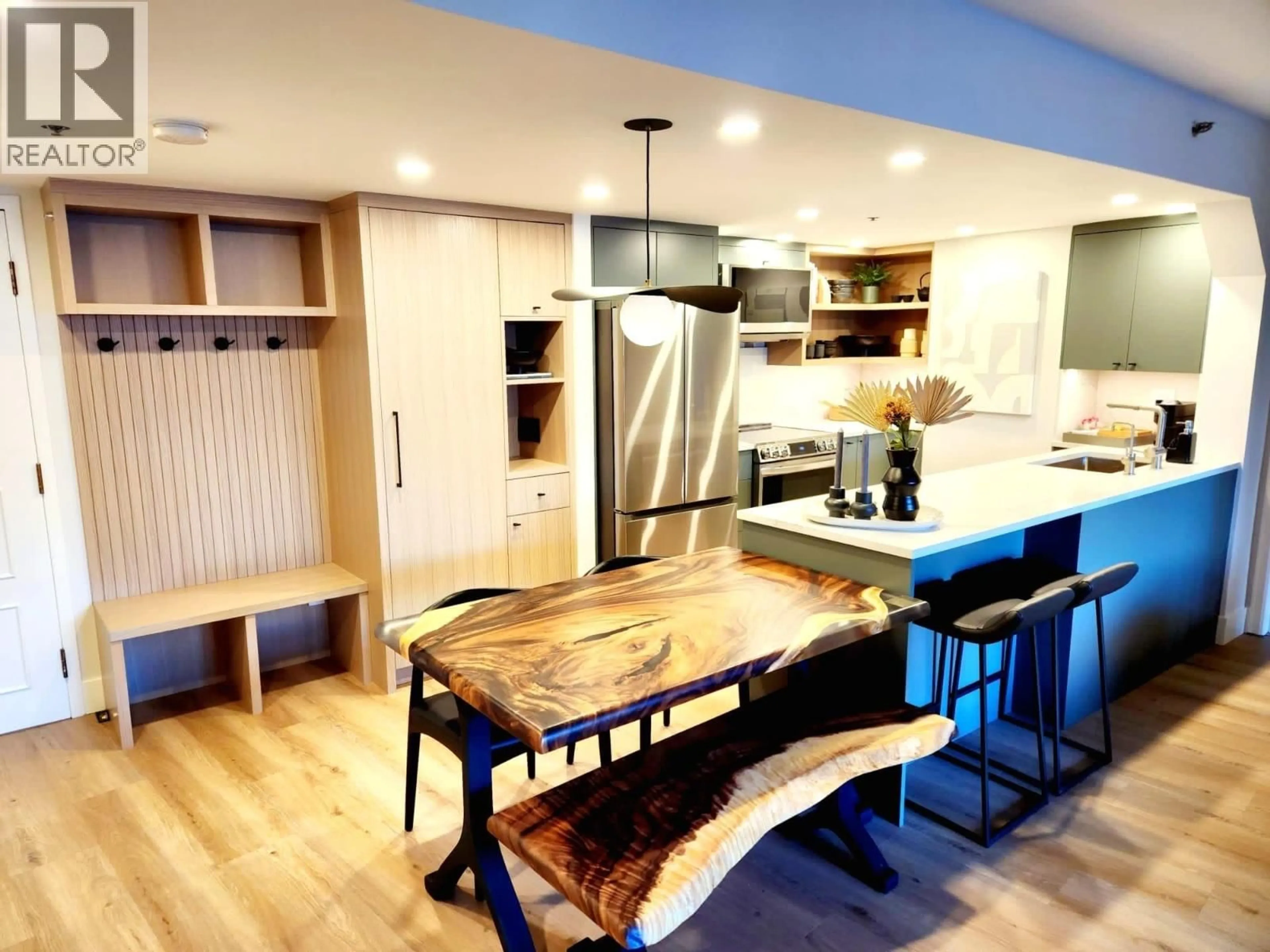 Open concept kitchen, wood/laminate floor for 307 - 4280 MOUNTAIN SQUARE, Whistler British Columbia V8E1B9