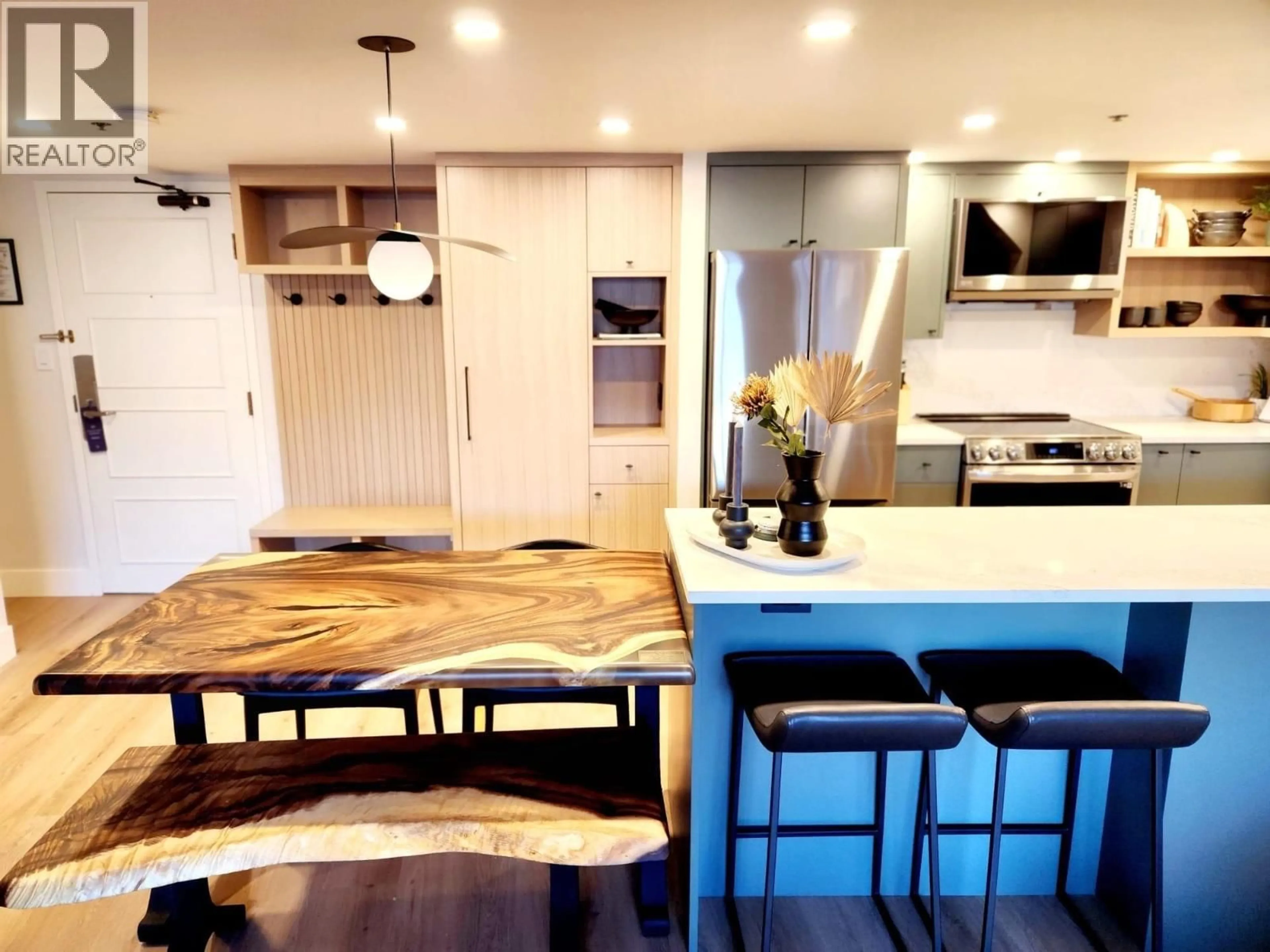 Open concept kitchen, wood/laminate floor for 307 - 4280 MOUNTAIN SQUARE, Whistler British Columbia V8E1B9