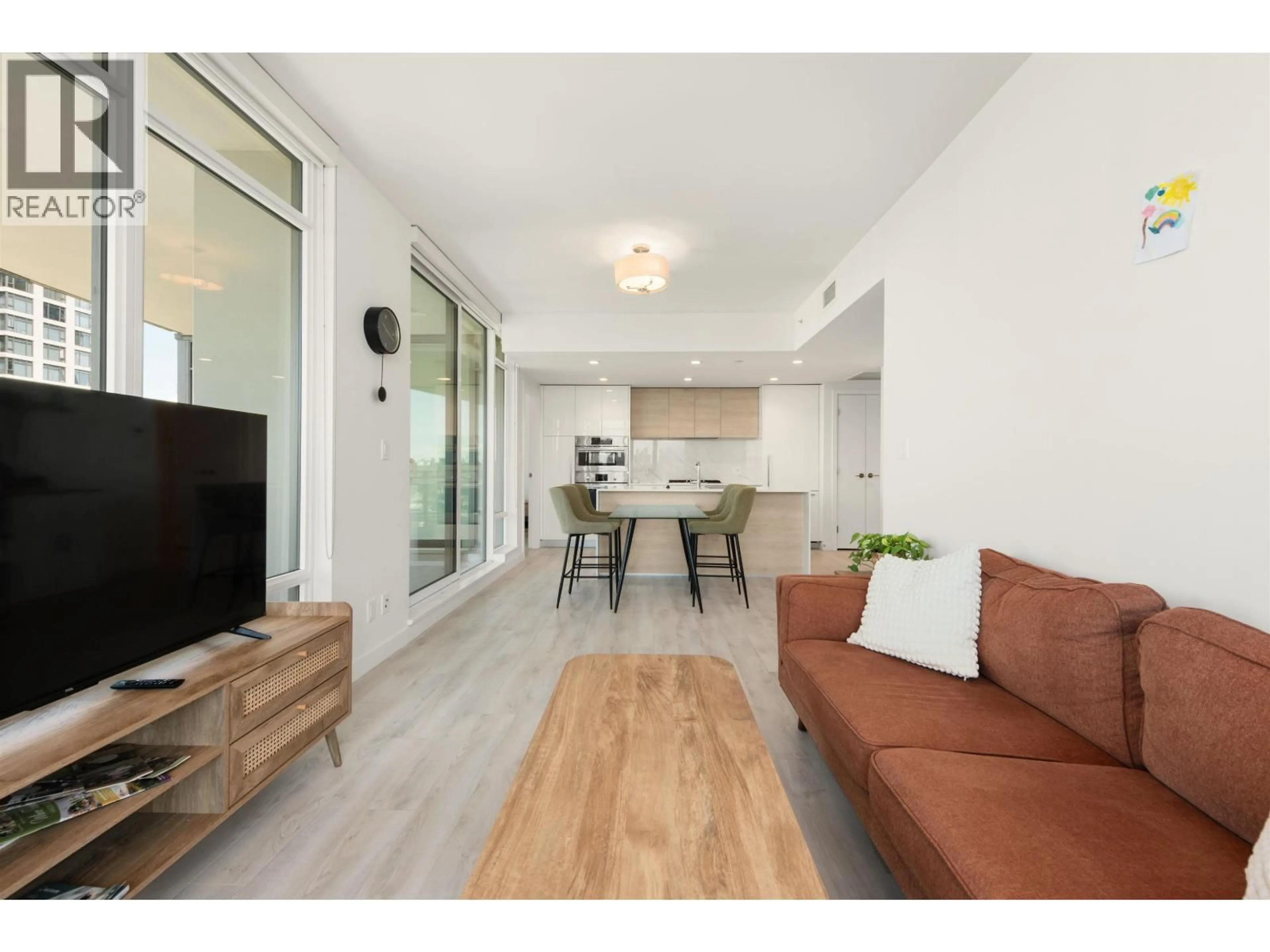 Living room with furniture, wood/laminate floor for 1808 - 2085 SKYLINE COURT, Burnaby British Columbia V5C0M6