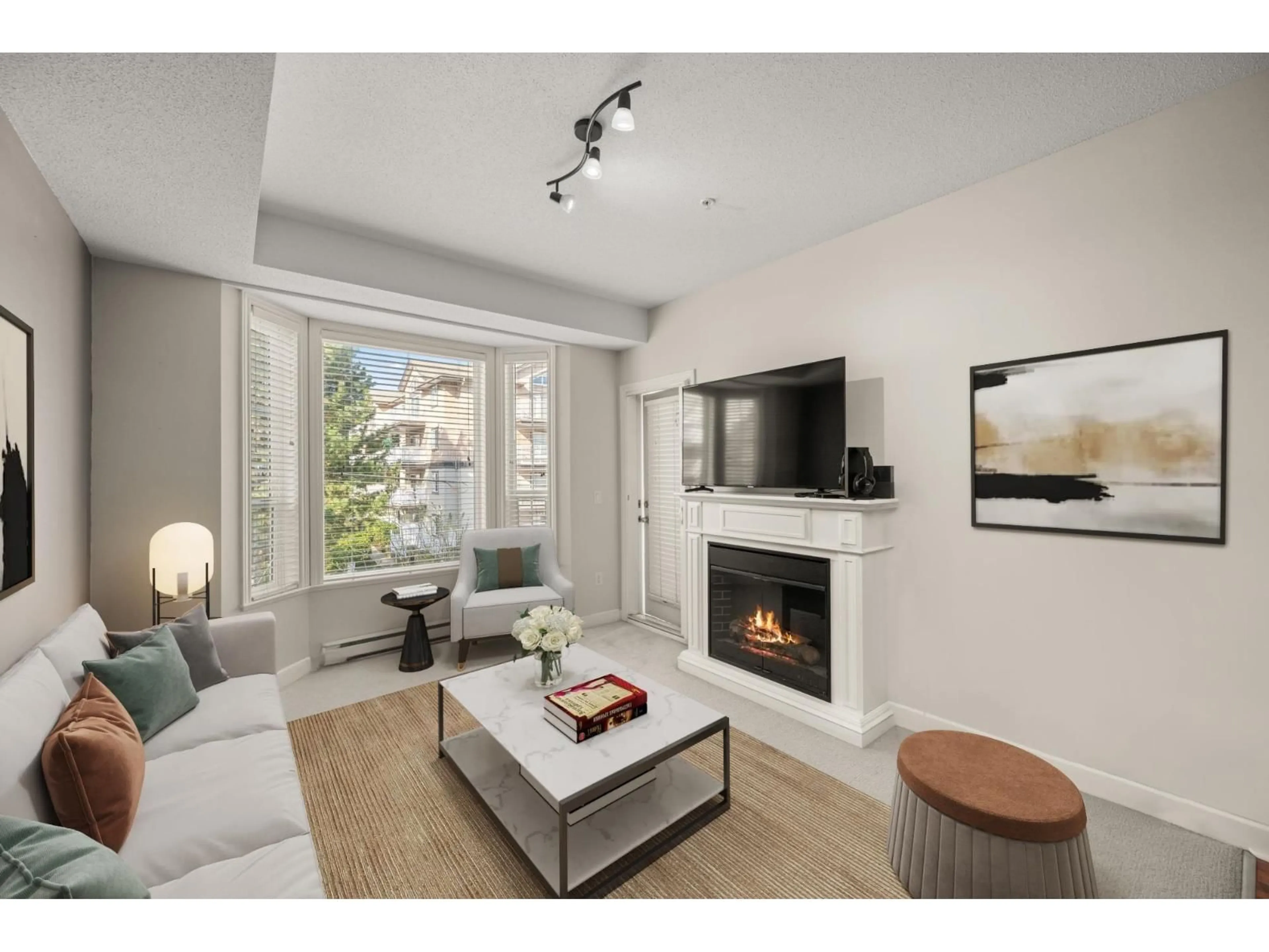 Living room with furniture, wood/laminate floor for 203 - 20281 53A, Langley British Columbia V3A3V6