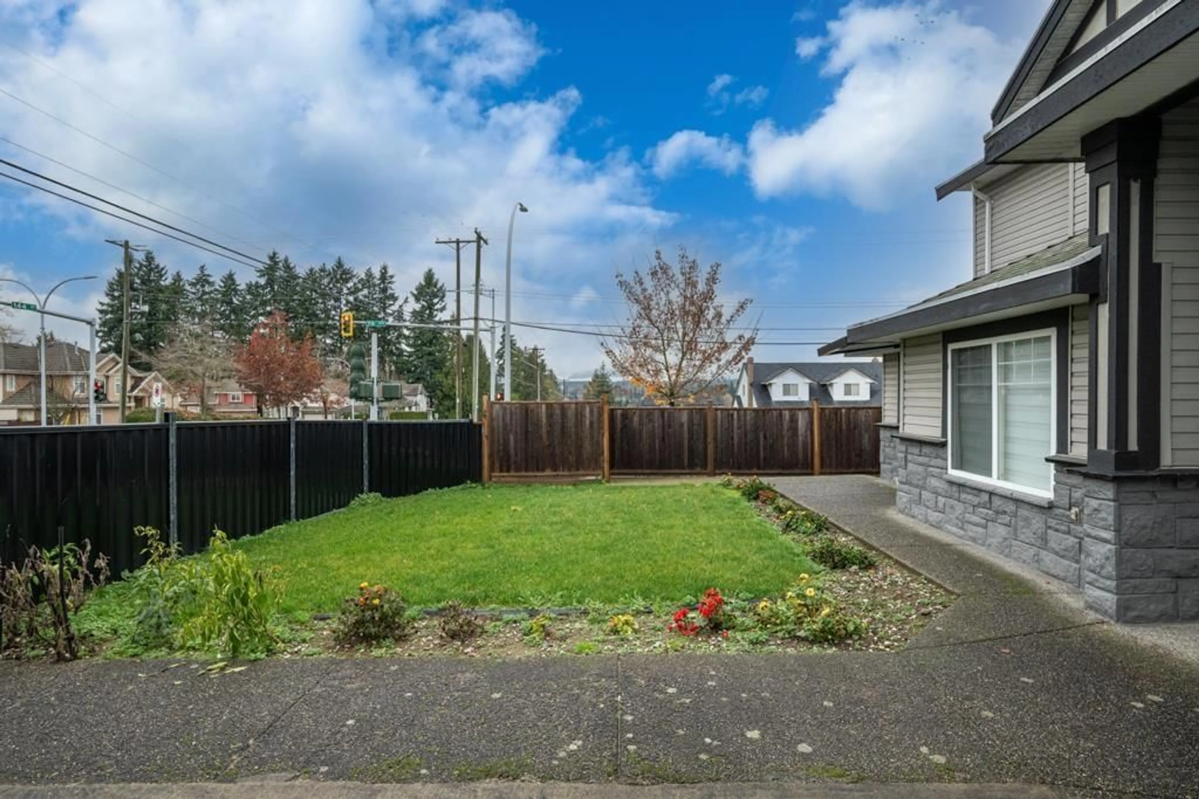A pic from outside/outdoor area/front of a property/back of a property/a pic from drone, street for 7596 144 STREET, Surrey British Columbia V3W5S6