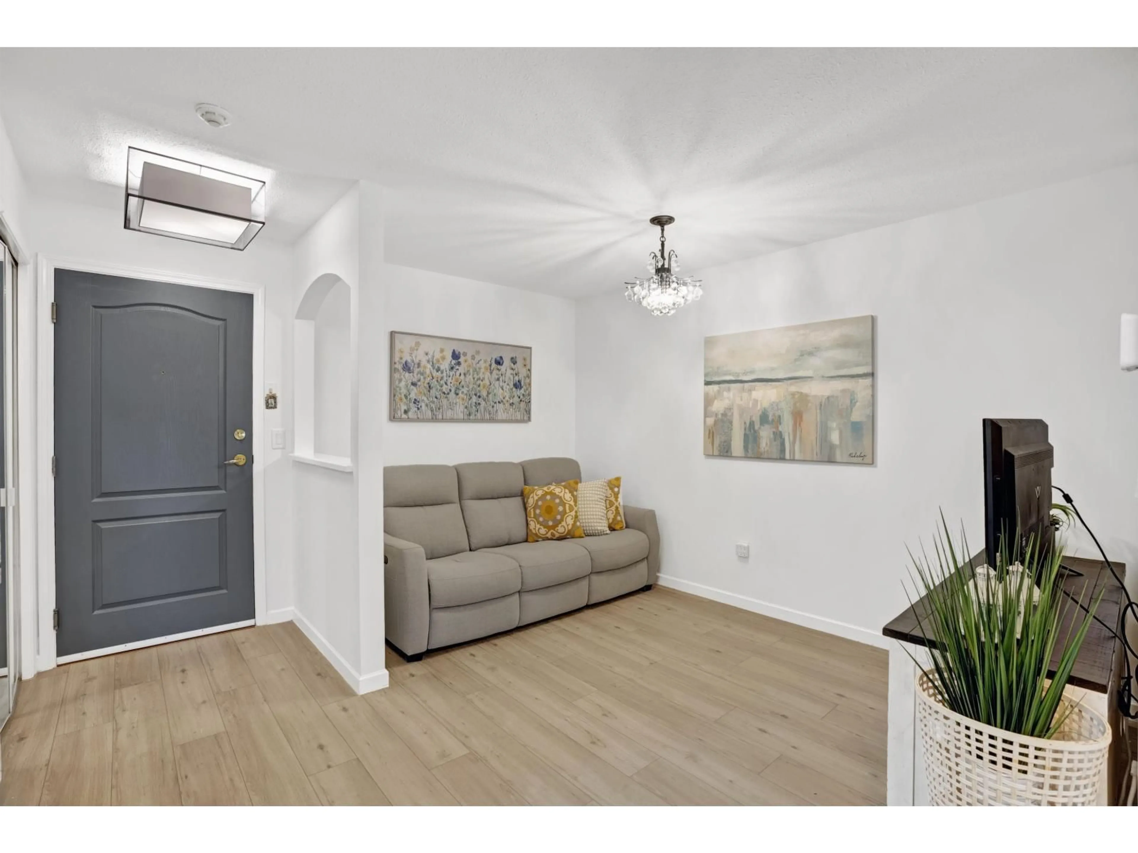 Living room with furniture, wood/laminate floor for 204 - 15298 20, Surrey British Columbia V4A2A3